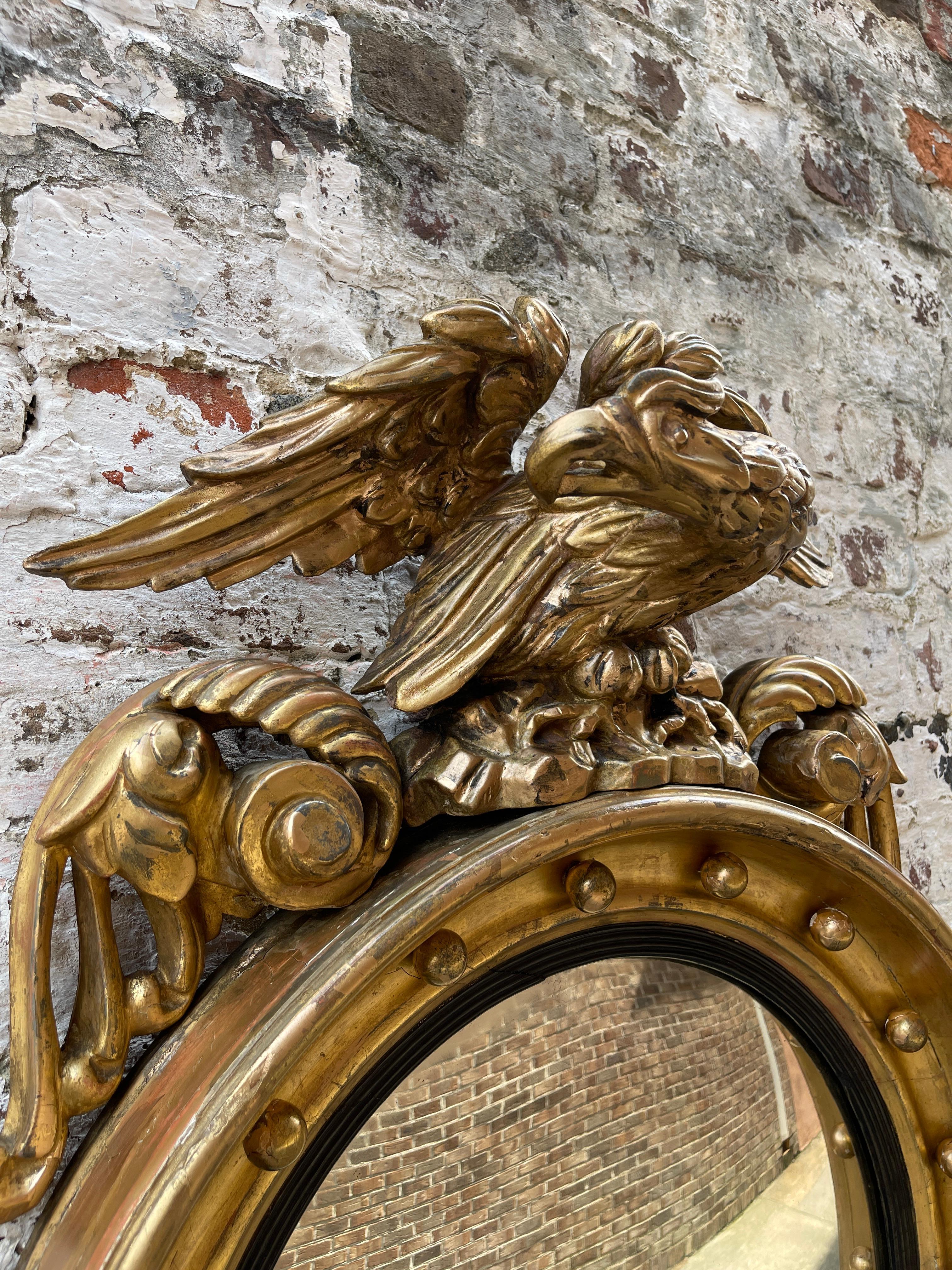 Early 19th Century English convex mirror with bold eagle on plinth 19th century  For Sale