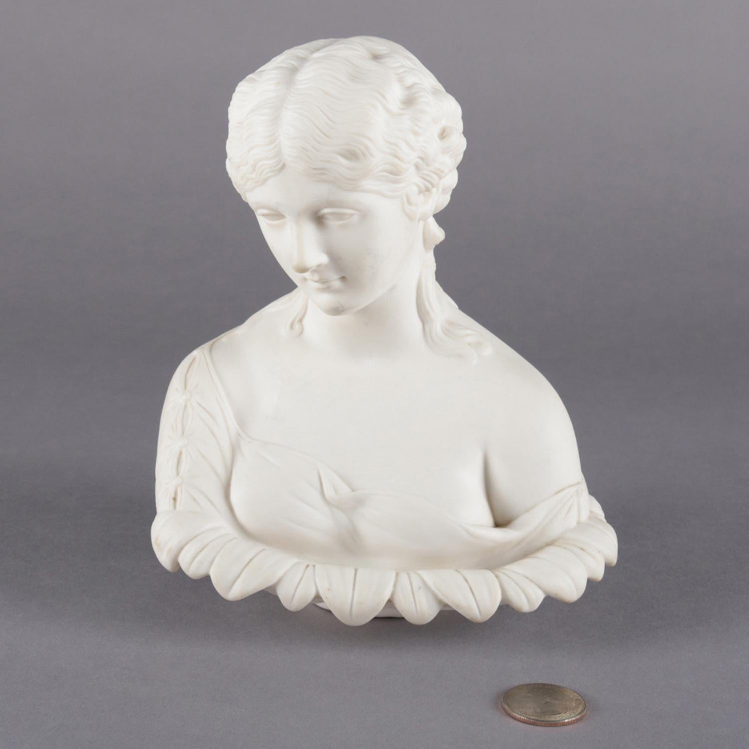 English Copeland School Parian portrait bust sculpture depicts classical woman framed by floral petals, reminiscent of a flower, circa 1890.

Measures: 8