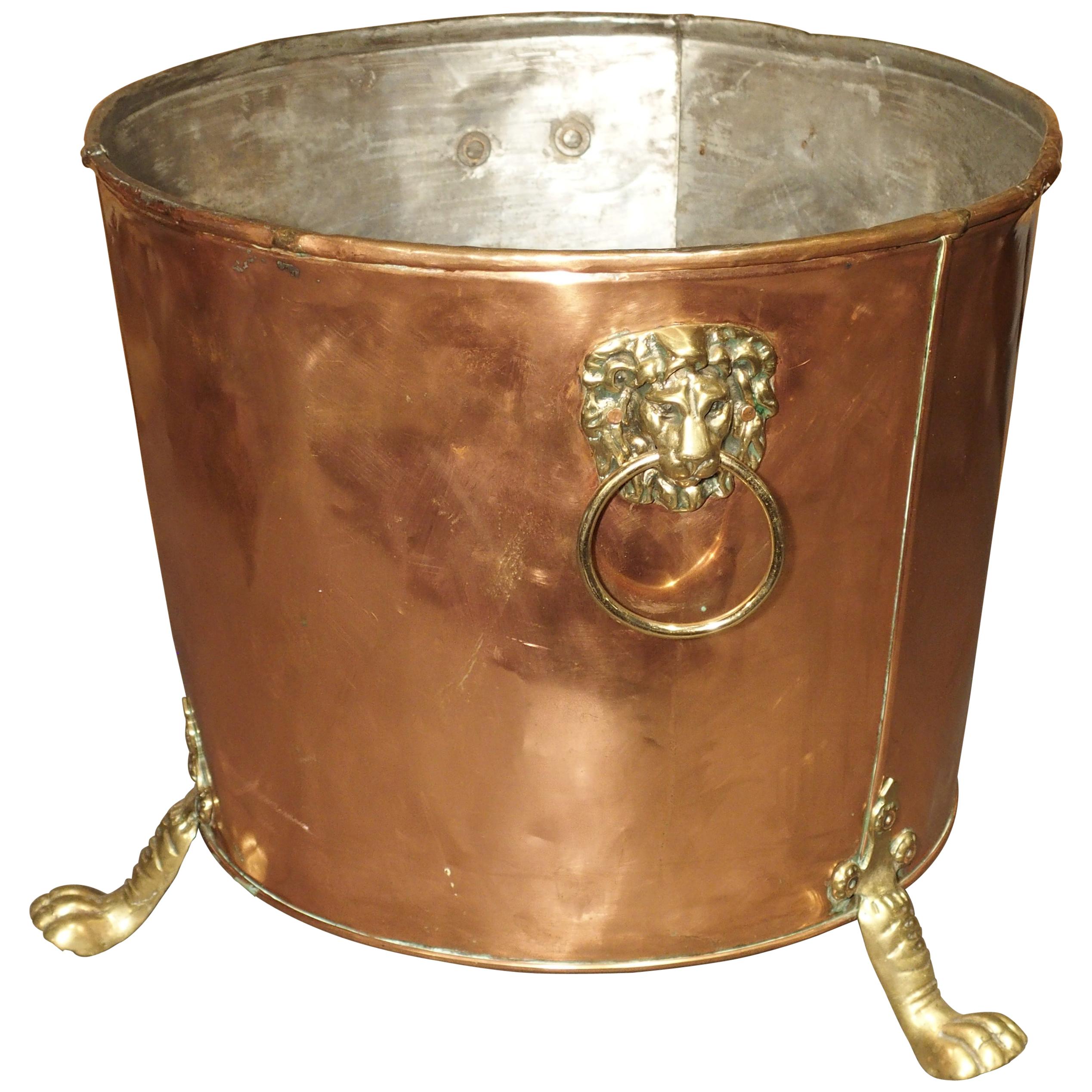English Copper and Brass Log Bucket with Lion Head Ring Handles and Paw Feet