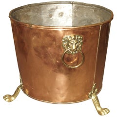 English Copper and Brass Log Bucket with Lion Head Ring Handles and Paw Feet