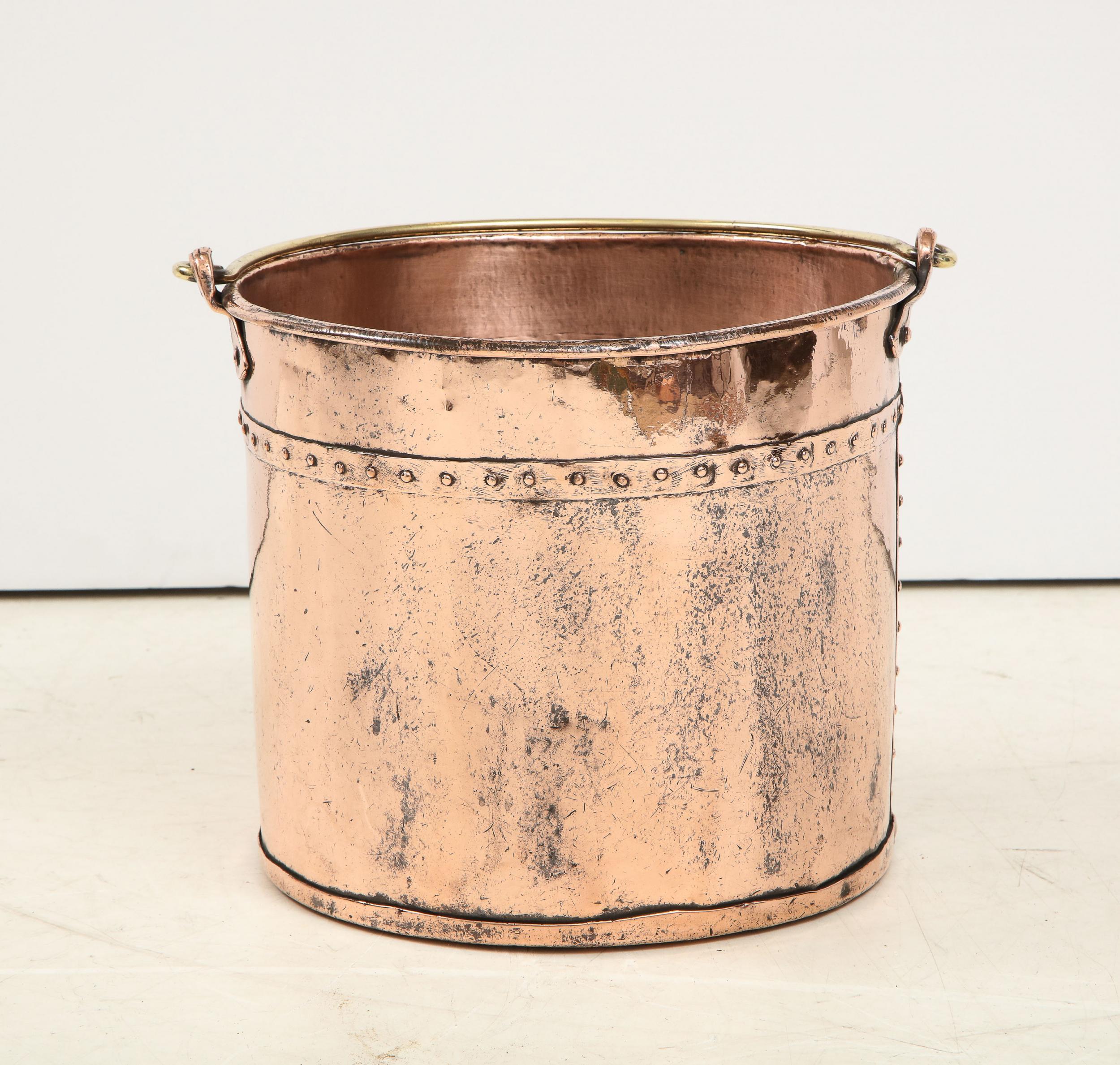 Good English 19th century hammered copper apple kettle, having brass bail handle, hand riveted seams and rich rose glow. Ideal for kindling bucket.