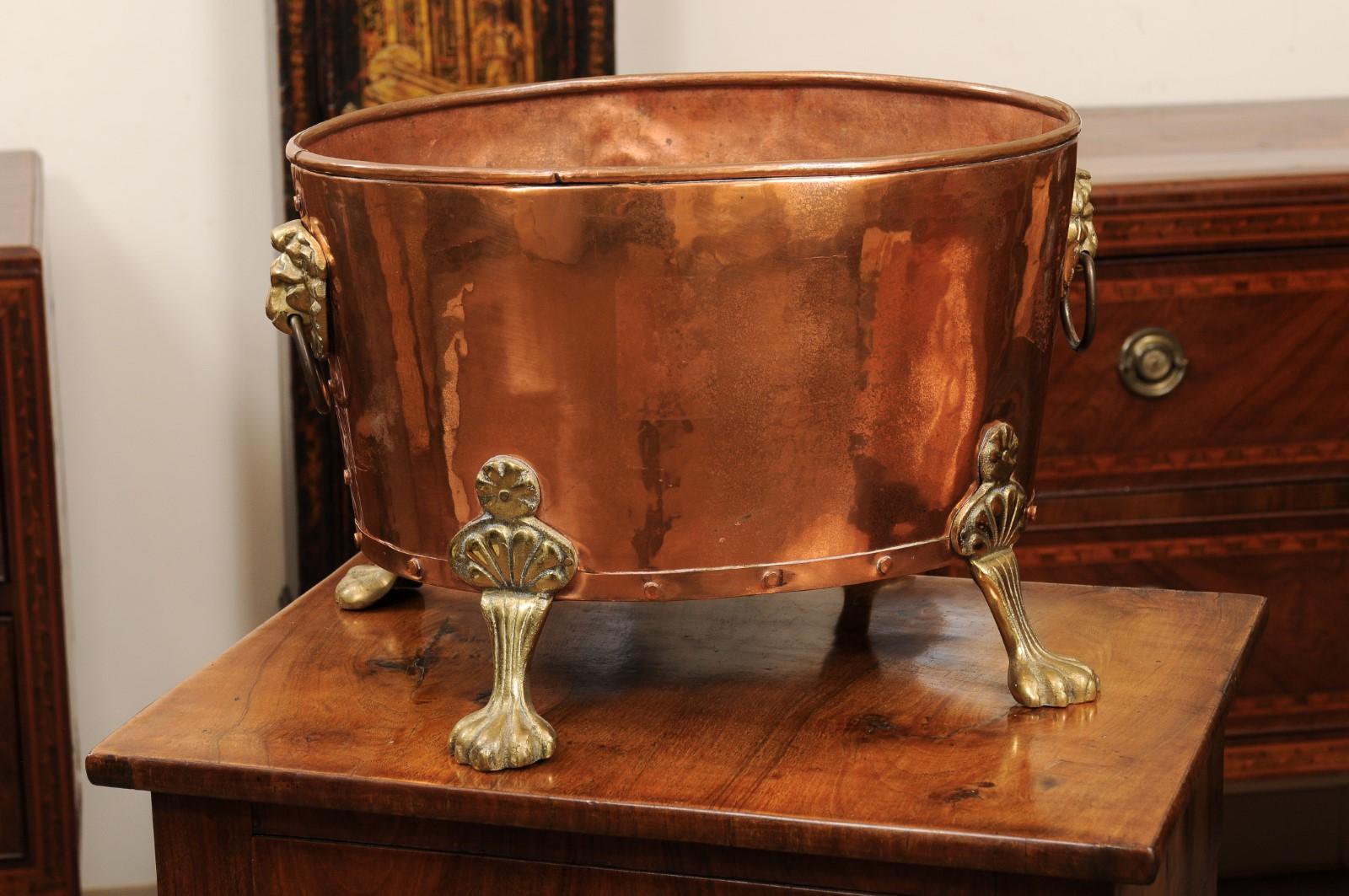 antique copper pots with brass handles