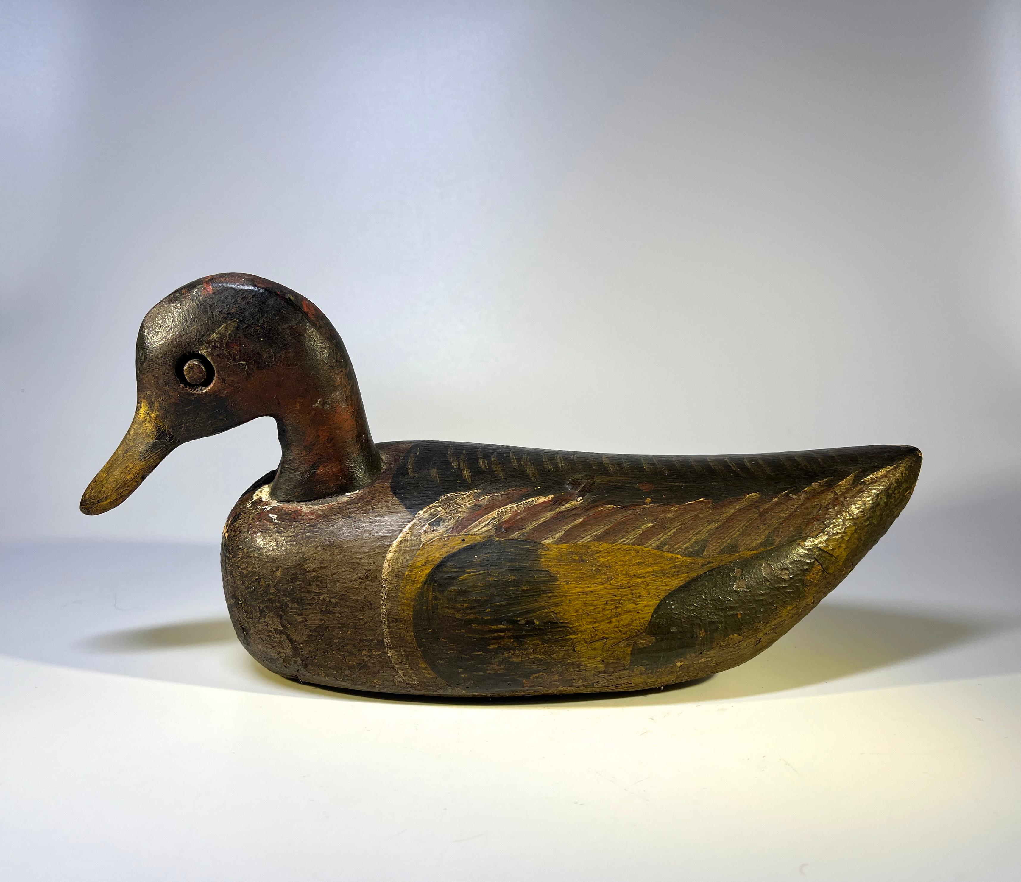 Antique English wood and cork waterfowl decoy with superb original paint
Aged hand painted surface, lightweight and handcrafted in England.
Circa early 20th century.
Tip of beak to tail 11 inch, width across body 4.5 inch, height 5