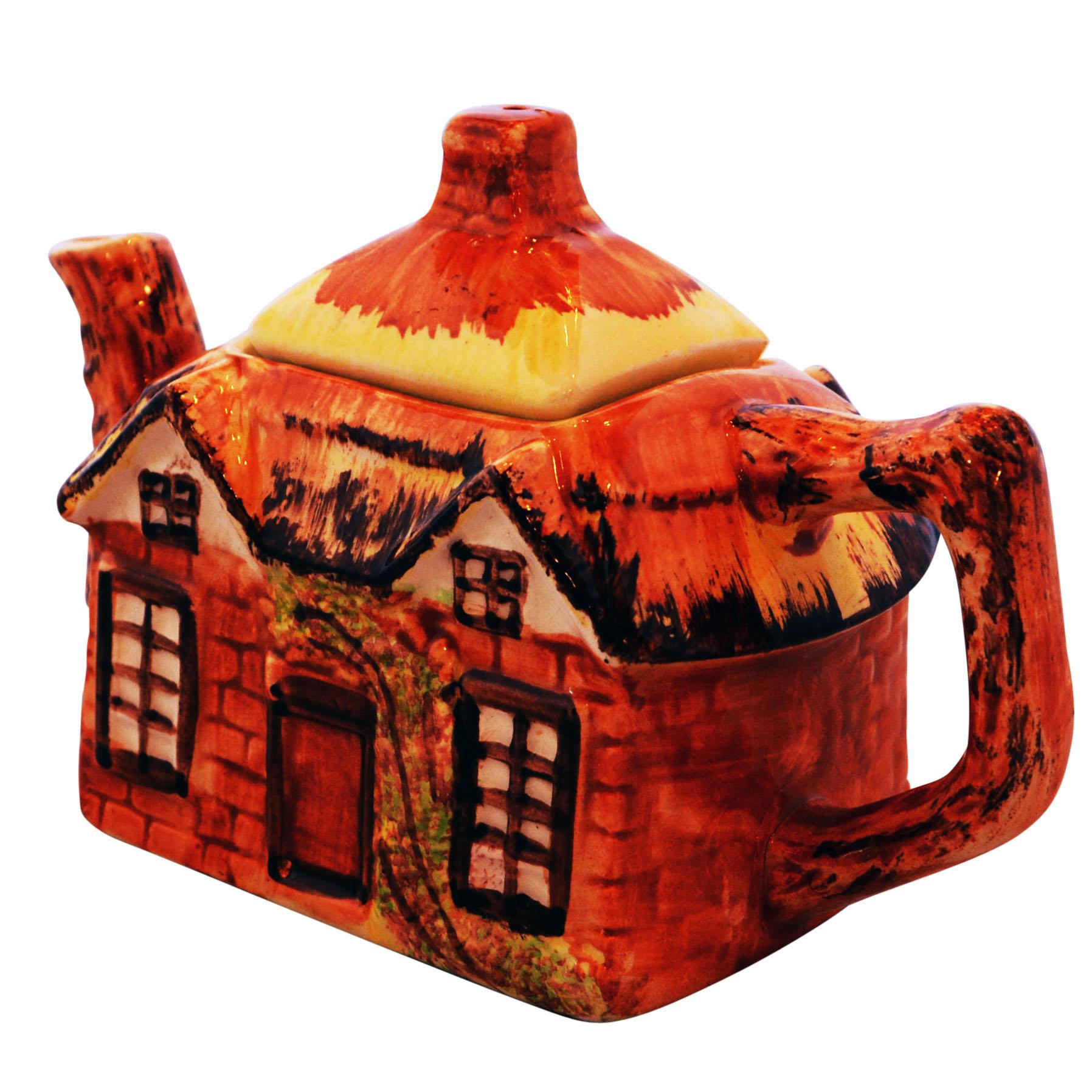 Lovely hand painted Kensington Cottageware teapot. Features thatched roof decorated on all four sides.