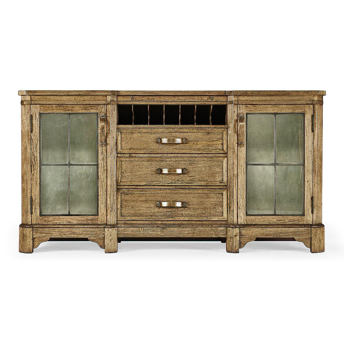 English Country Buffet sideboard with planked driftwood glazed low wall cabinet with internal lighting, two doors, and adjustable glass shelves. With three graduated drawers and a wine rack. Wooden strap handles with patinated brass