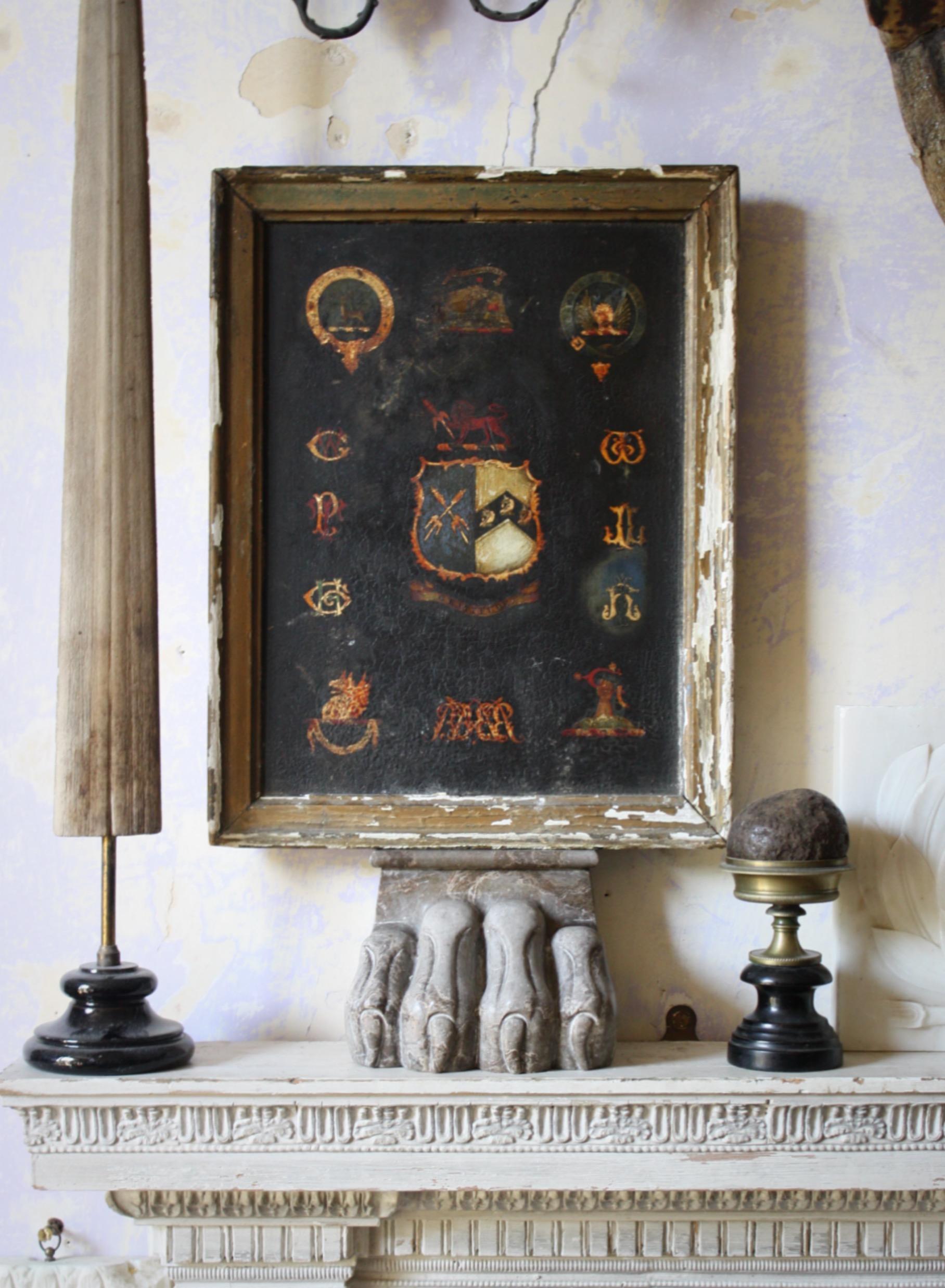 A larger than the norm coach panel, oil on board of an armorial centred by a lion above a halved shield with the motto 