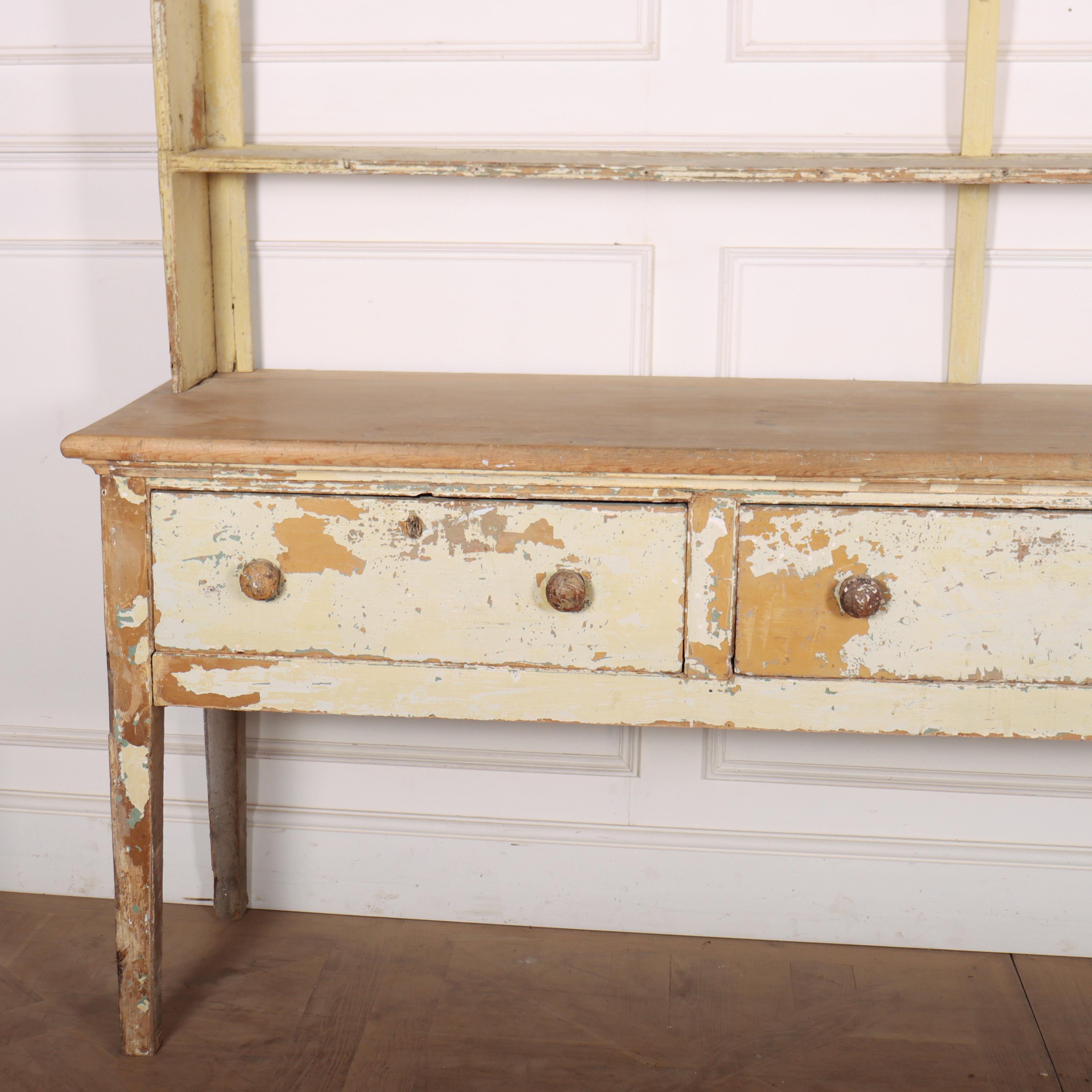 Wonderful late 18th century English original painted pine country house dresser with a good scrubbed top. 1790.

Code: 8549

Dimensions:
W: 90