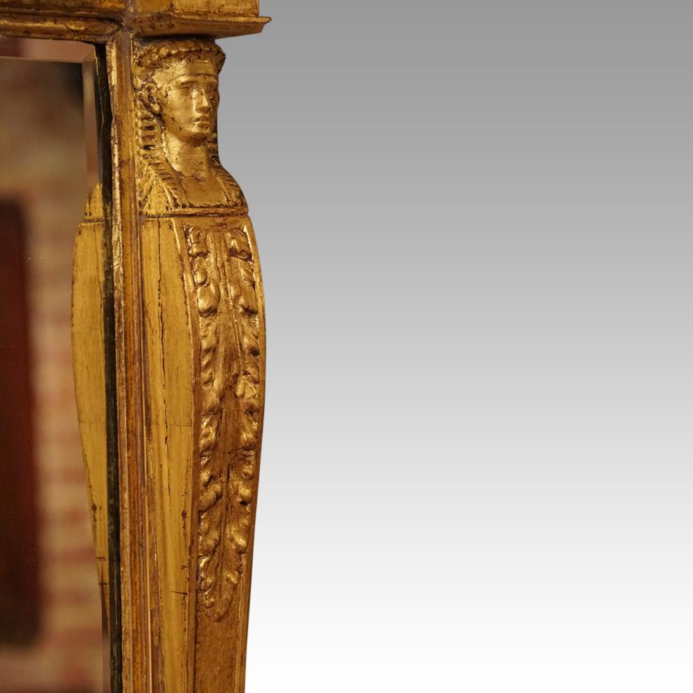 This Regency gilt Egyptian revival mirror is a Classic and would add a great presence to your room

To each side of the beveled mirror are caryatids of Egyptian women, the heads above acanthus leaf carving and ending with the carved feet. Above a