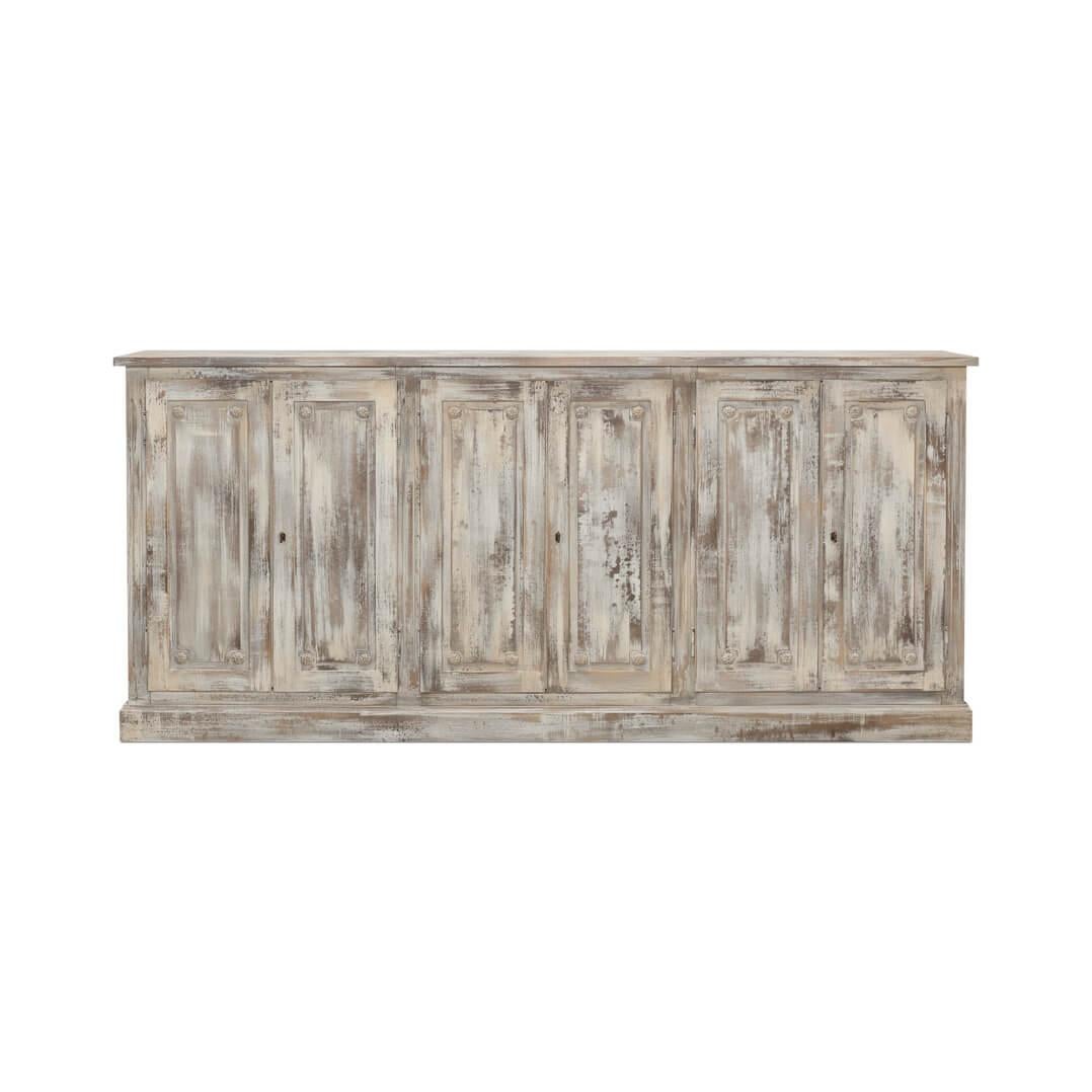 With six paneled cupboard doors, each adorned with carved floral rosettes, raised on a simple square plinth base. This substantial piece brings a storied elegance to your dining area or living space.

The beautifully weathered gray finish creates a
