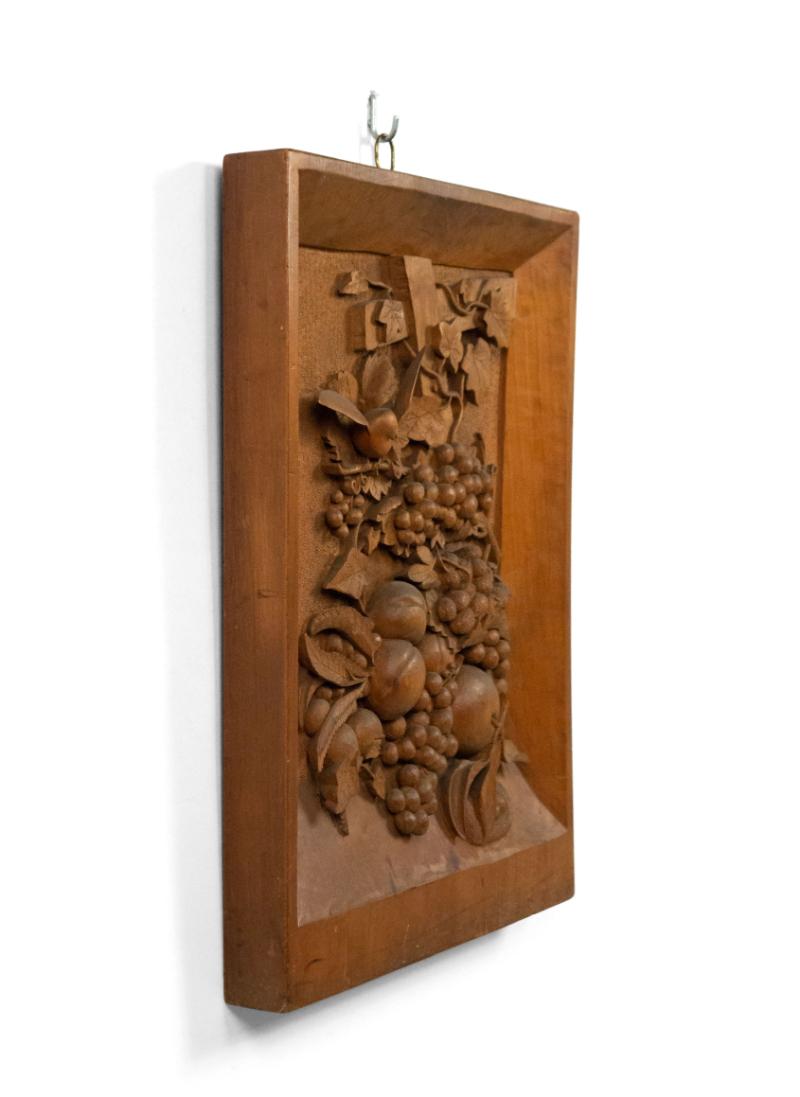 English Country style (19th Century) carved walnut wall plaque with grape and floral design and bird.