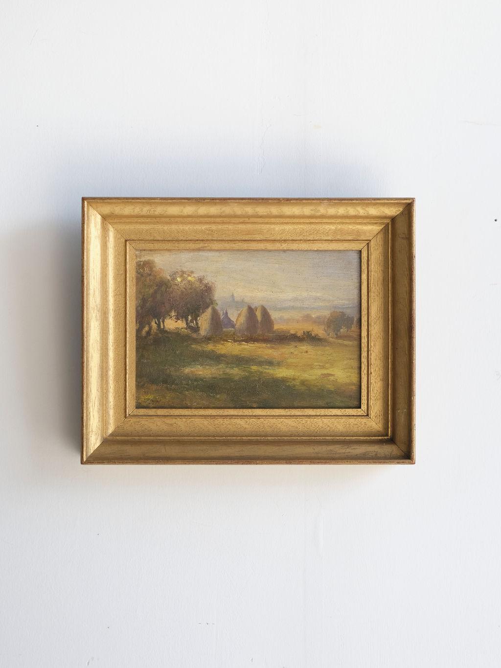 This framed oil painting of an English countryside would make a stunning addition to any room. The dull greens and blues of this painting make for a calm and soothing accent piece. The gold frame is about 1.5 to 2 inches thick and really adds