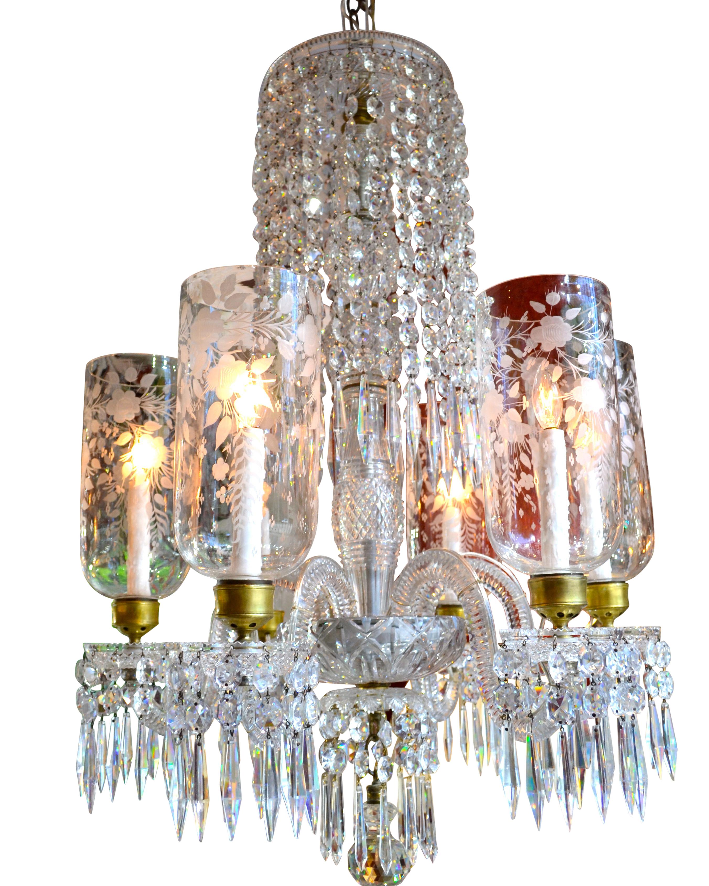 A 19th century English cut crystal chandelier of the highest quality, likely made by the firm of either Osler of Birmingham, Blades or Waterford. Every piece of this chandelier including the components of the central stem are heavily cut and