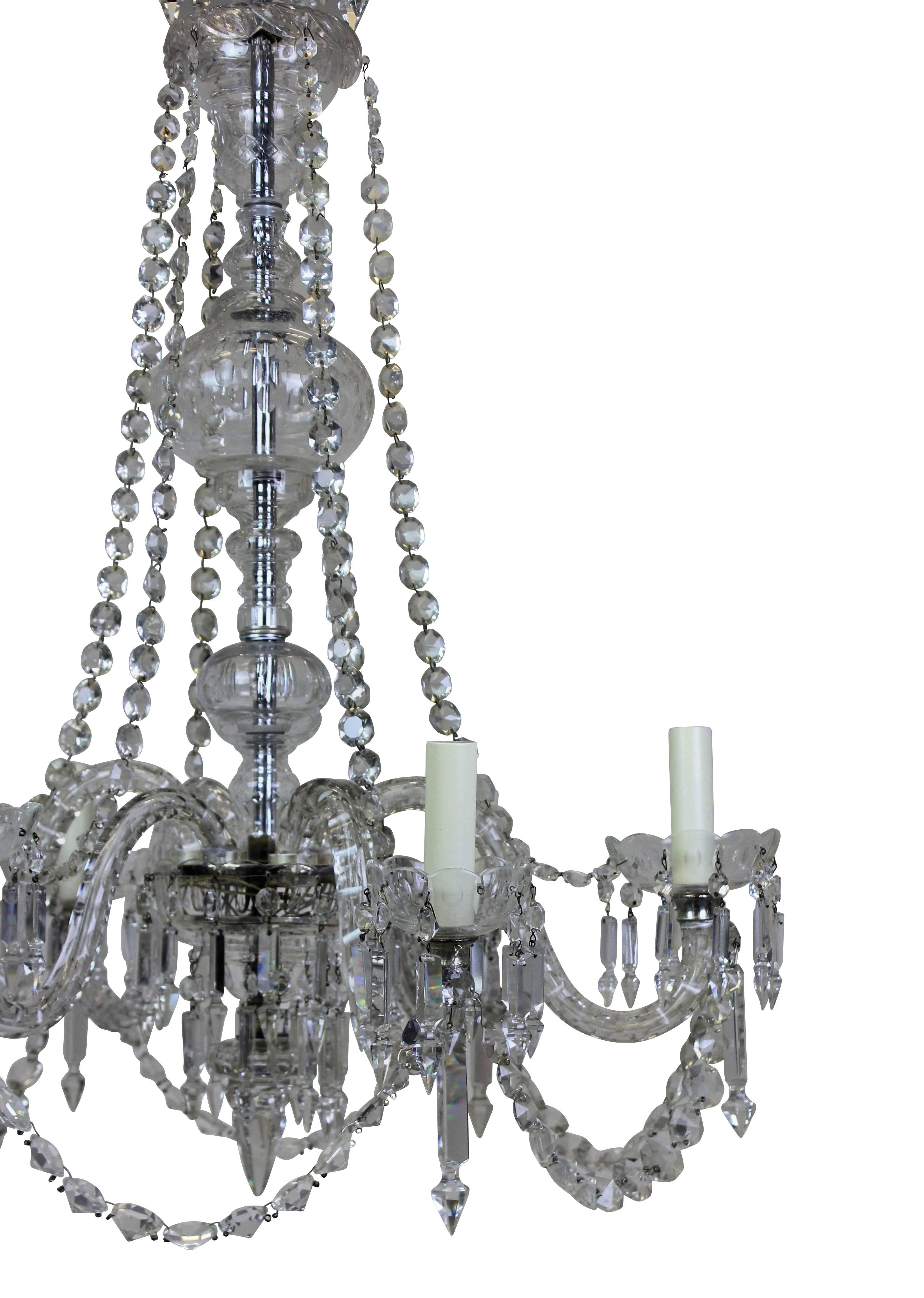 An English cut-glass six-arm chandelier of good quality.