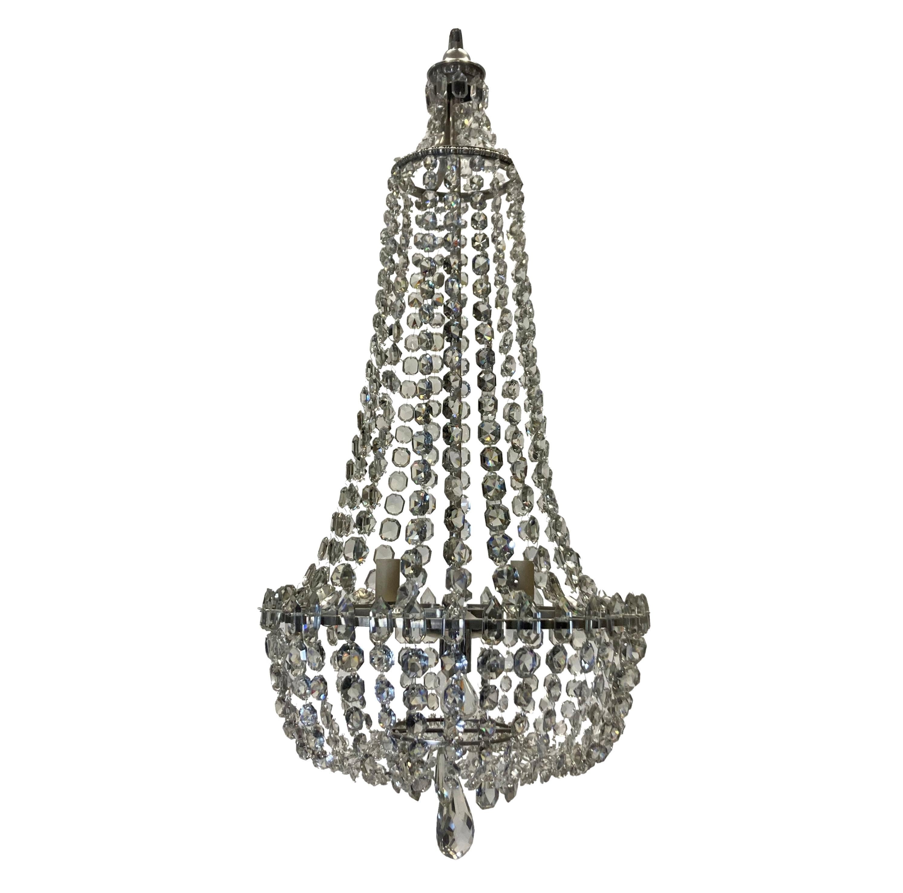 An English tent and bag chandelier, with silver plated metal work. Hung throughout with cut glass and provision for four lights internally.