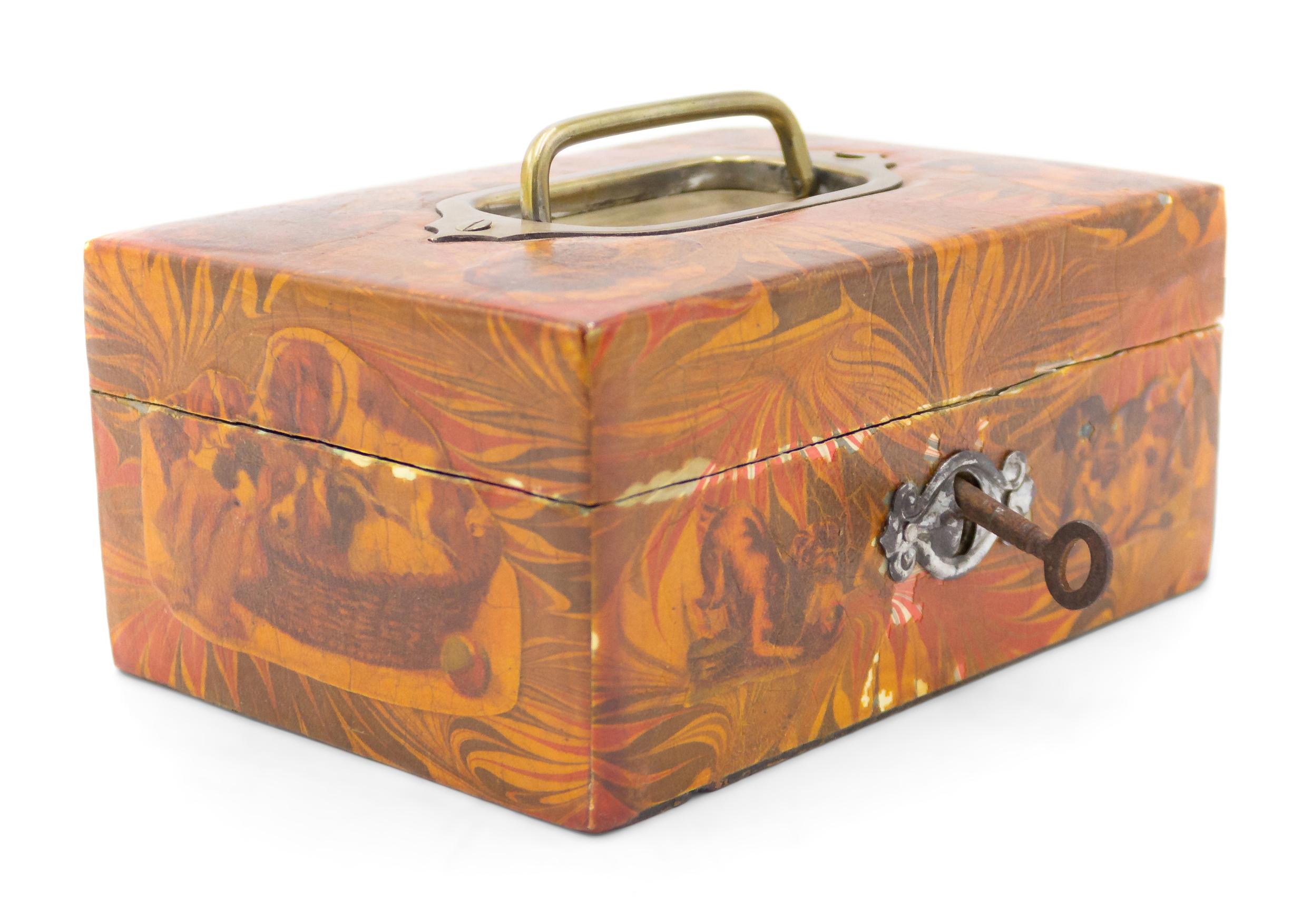 English (20th Century) decoupage box with dog head design and silver handles.
  