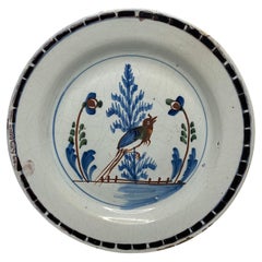 Used English Delft pancake plate, Long tailed bird, London, c. 1750.
