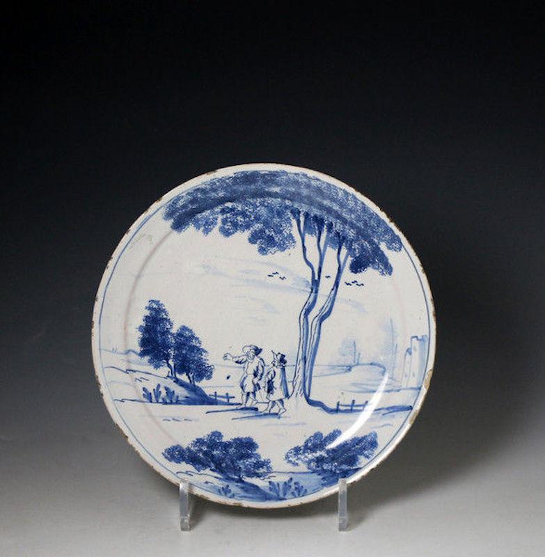 Mid-18th Century English Delftware Plate with Scene of Two Figures in a Rural Landscape, 1740 For Sale