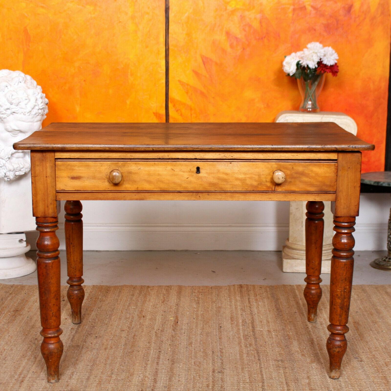 An impressive 19th century pine writing table.

Fitted a long frieze drawer mounted with good handles (chip to back plate of one), dovetailed jointing and raised on turned tapering legs.

England, circa 1860.