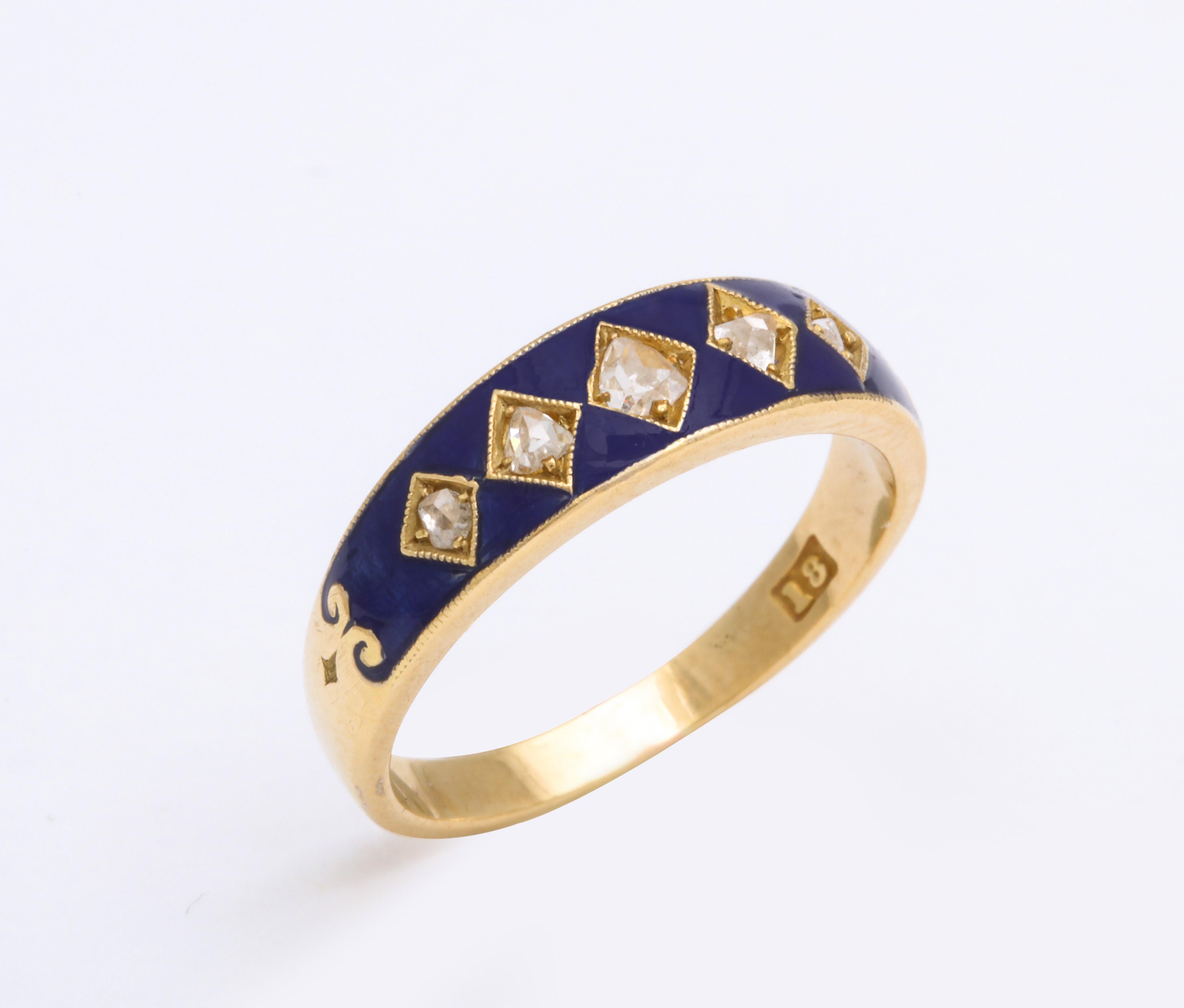 From the late 19th century, the top decorated in vibrant deep cobalt blue enamel enhanced with five graduated rose diamonds, set in lozenge-shaped bezels, mounted in 18k yellow gold. 

English, circa 1890, stamped 18.

Size 6 ½. Width of band: ¼ in.
