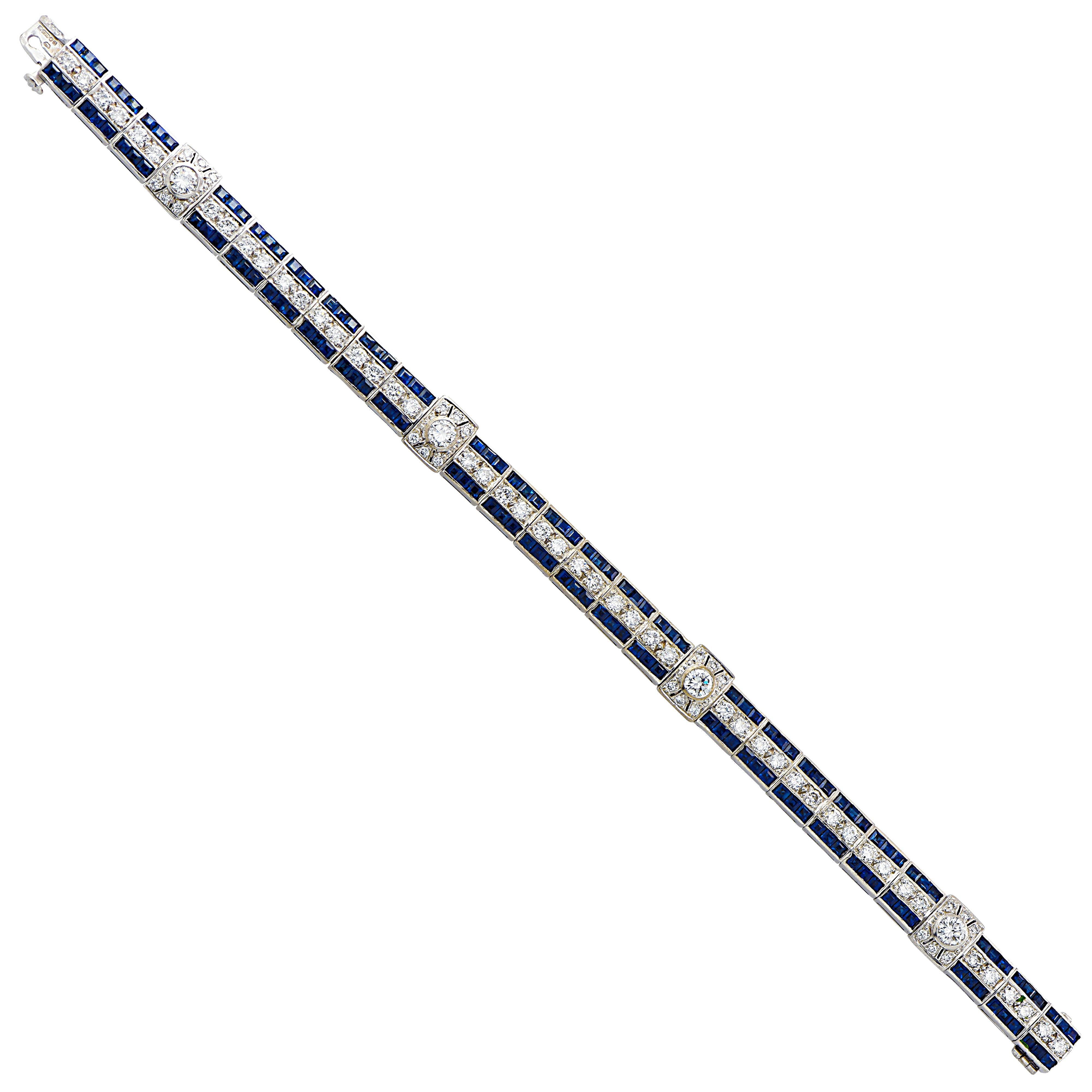 Sensational English bracelet crafted in platinum, featuring 52 round brilliant cut diamonds weighing approximately 3.4 carats total, G color, VS clarity, and 72 square blue sapphires weighing approximately 3 carats total. This striking bracelet