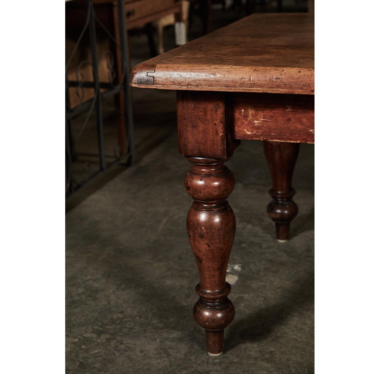 This impressive English table is called a scrub table, a term for tables that were used to prepare food. The table stands on massive, turned legs. The piece has one drawer.
 