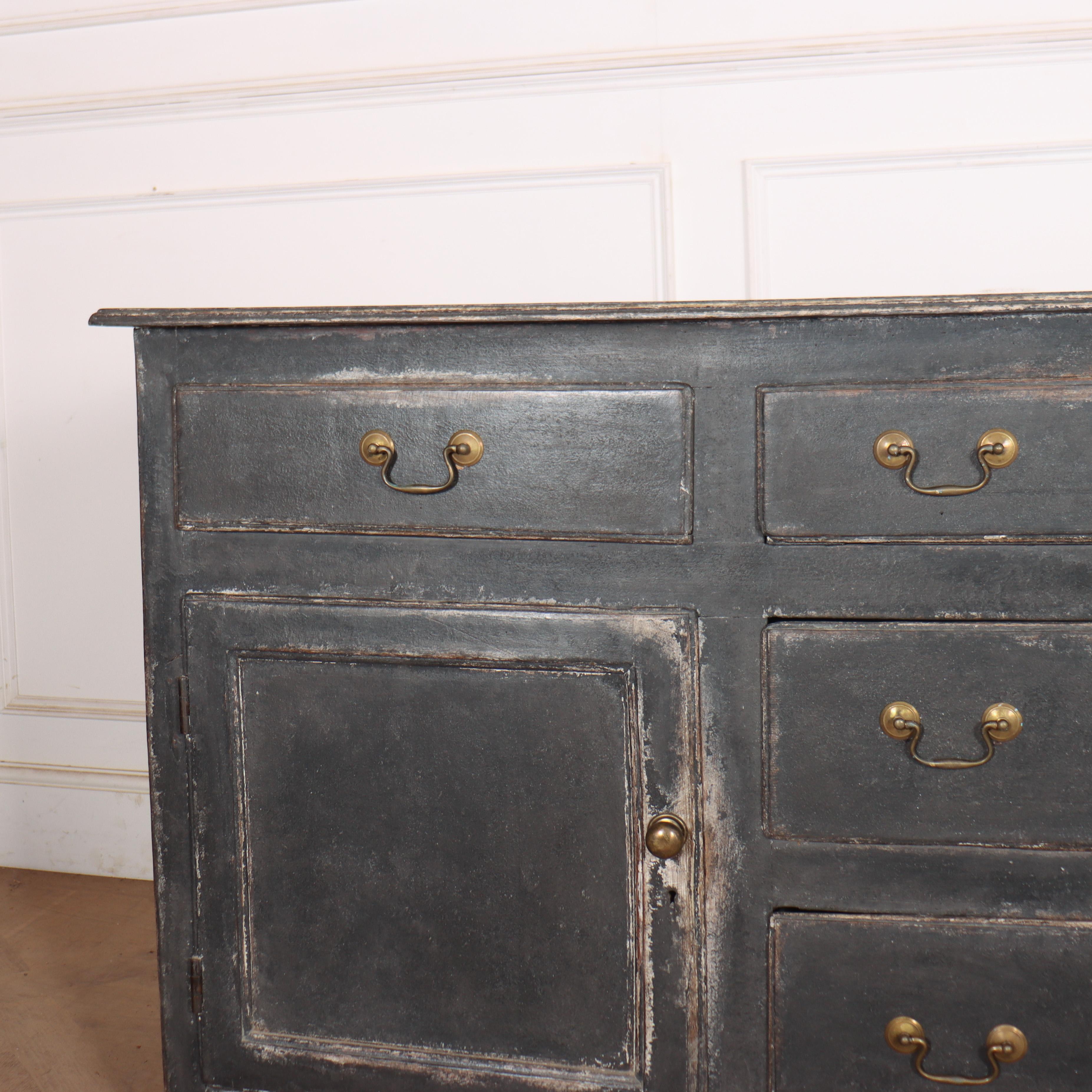 18th century English painted oak dresser base with good narrow proportions and very useful storage. 1780. 


Code: 8955

Dimensions:
W: 73