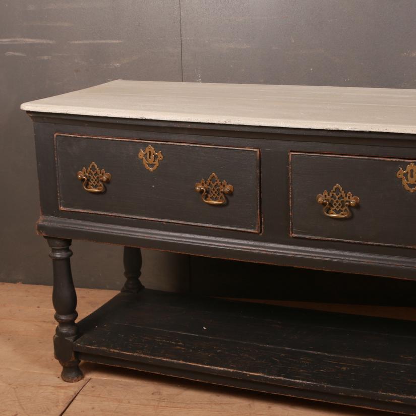 18th century painted oak and pine dresser base. 1760

Dimensions:
79 inches (201 cms) wide
20 inches (51 cms) deep
31 inches (79 cms) high.



  