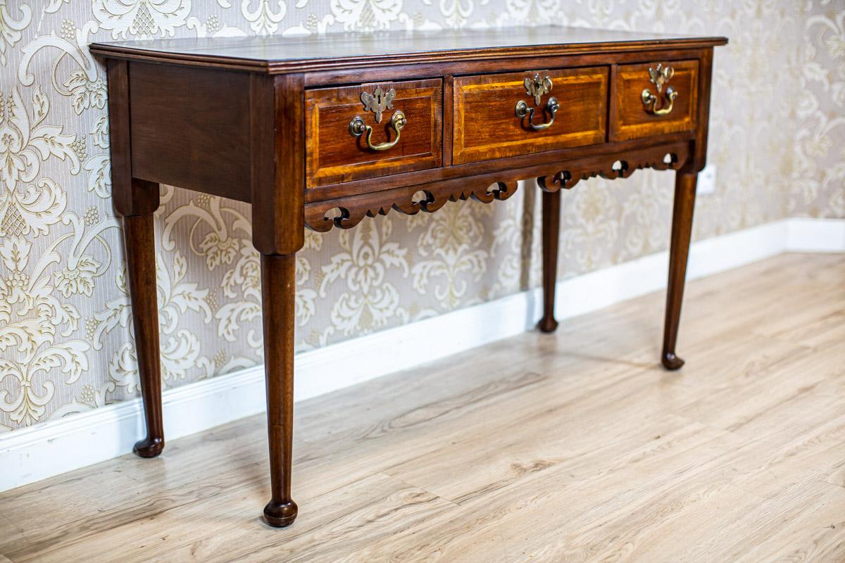 English Dressoir from the Turn of the 19th and 20th Centuries

We present you this type of a sideboard from the turn of the 19th and 20th centuries in the form of a cabinet.
The whole piece is of an oblong shape and placed on high legs.
There are