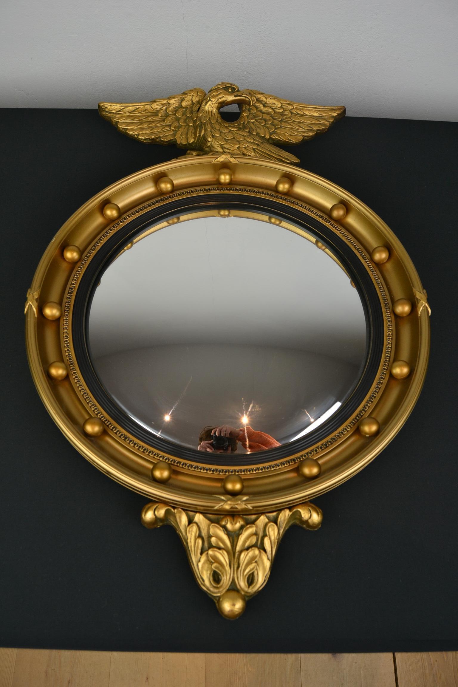 English Bullseye Mirror - Eagle Convex Mirror - Porthole Mirror with an Eagle on top.
This Gilt Resin Mirror, circular mirror has style and will suit your interior well.
Vintage gilt mirror made by Atsonea England in the 1960s.
Regency - Hollywood