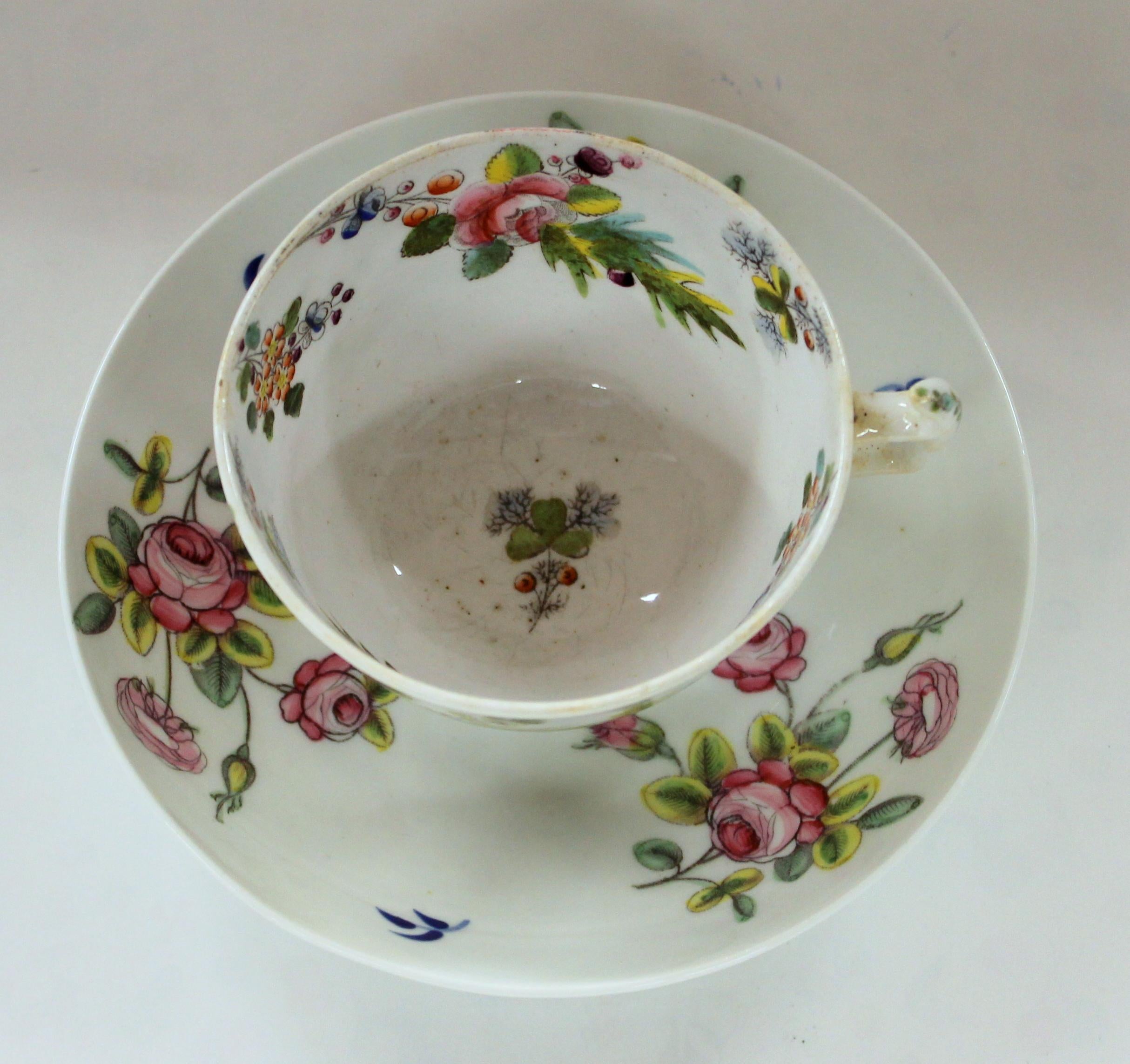 Rare and fine antique English new hall porcelain floral decor cup and saucer
Rare printed mark on saucer. Pristine condition. Colors are still vibrant.

Saucer: 5 1/2