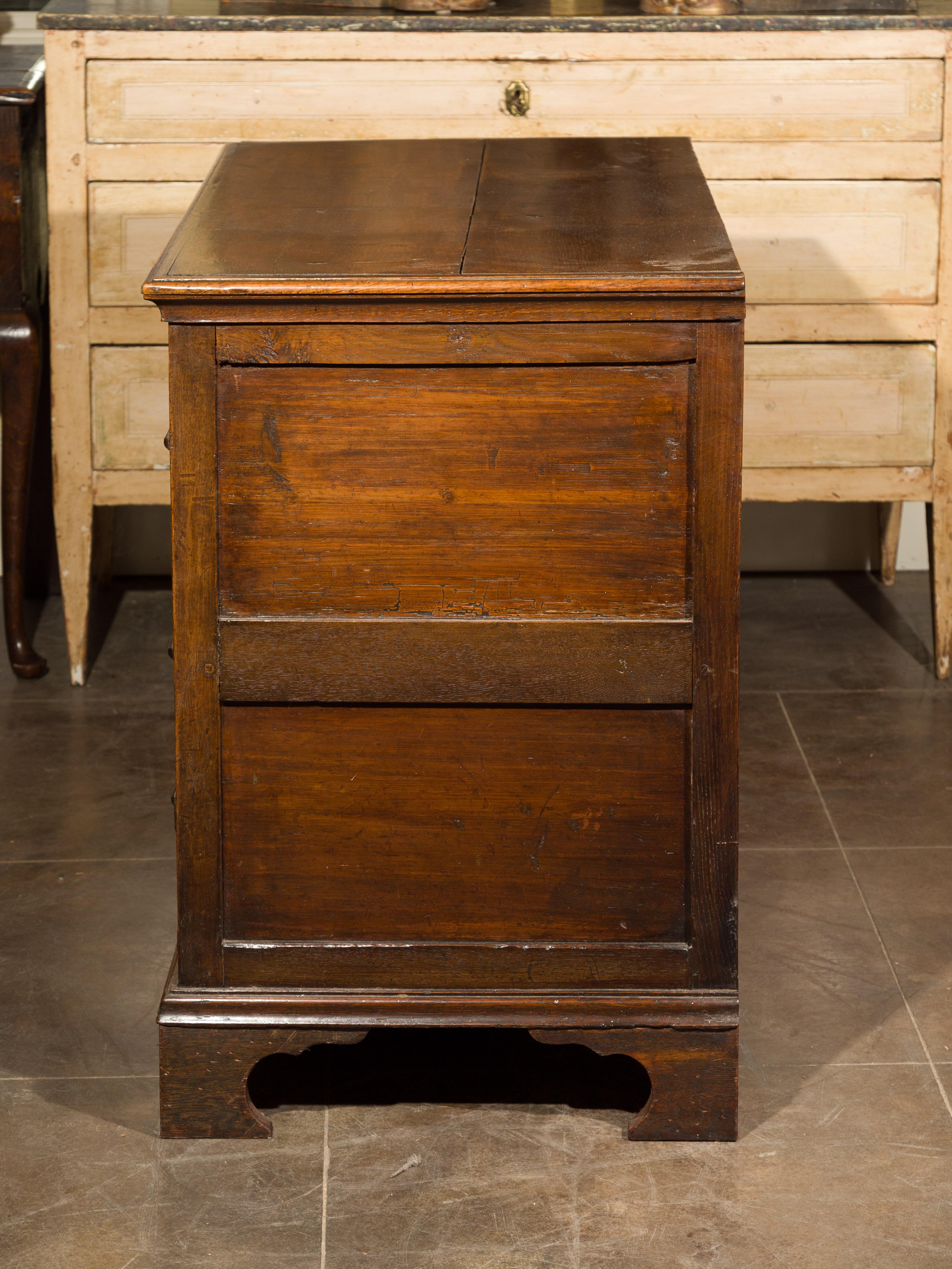 English Early 19th Century Oak Geometric Front Four-Drawer Chest on Bracket Feet For Sale 9