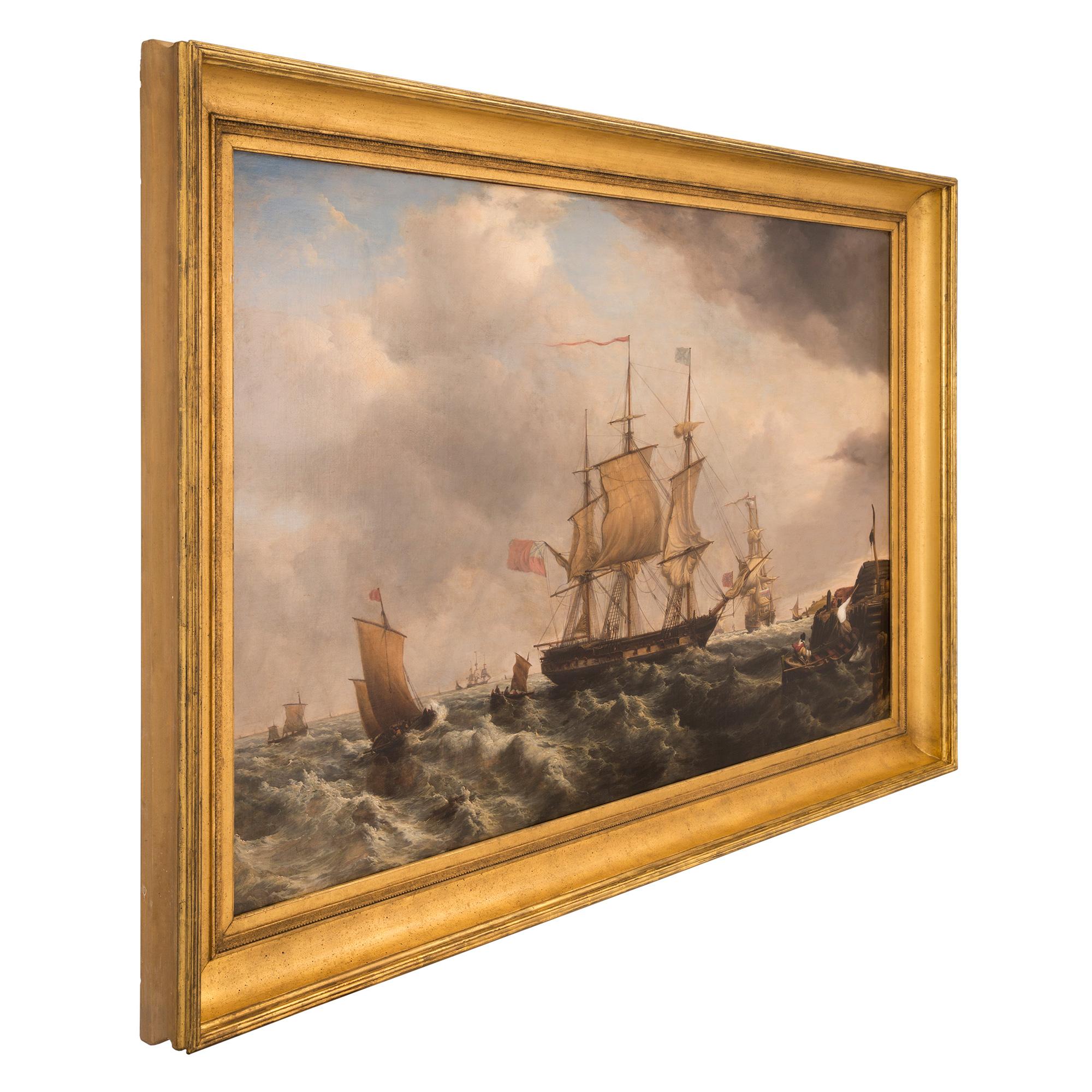 An outstanding English early 19th century oil on canvas painting of a maritime scene, by Thomas Luny. The beautiful painting is framed within an elegant mottled giltwood frame. At the center is a most impressive three mast ship in choppy seas.