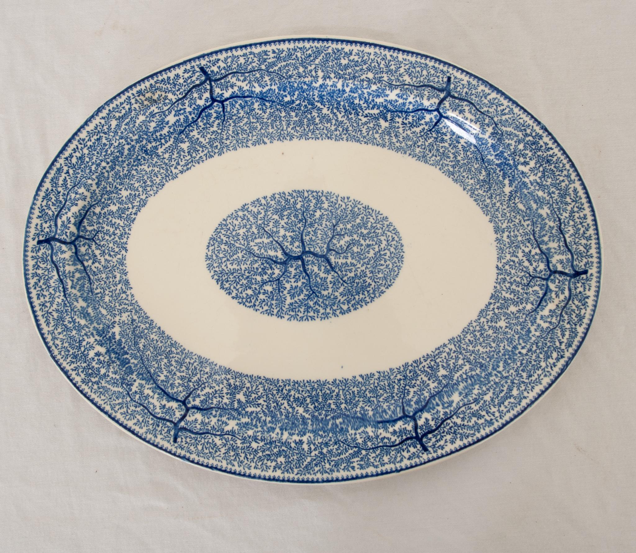 An antique early 20th century English platter in the Fibre pattern from Wood and Sons. Absalom Wood and his son Thomas Francis Wood established Wood & Son makers of British pottery and porcelain in 1865 which then became Wood & Sons circa 1907.