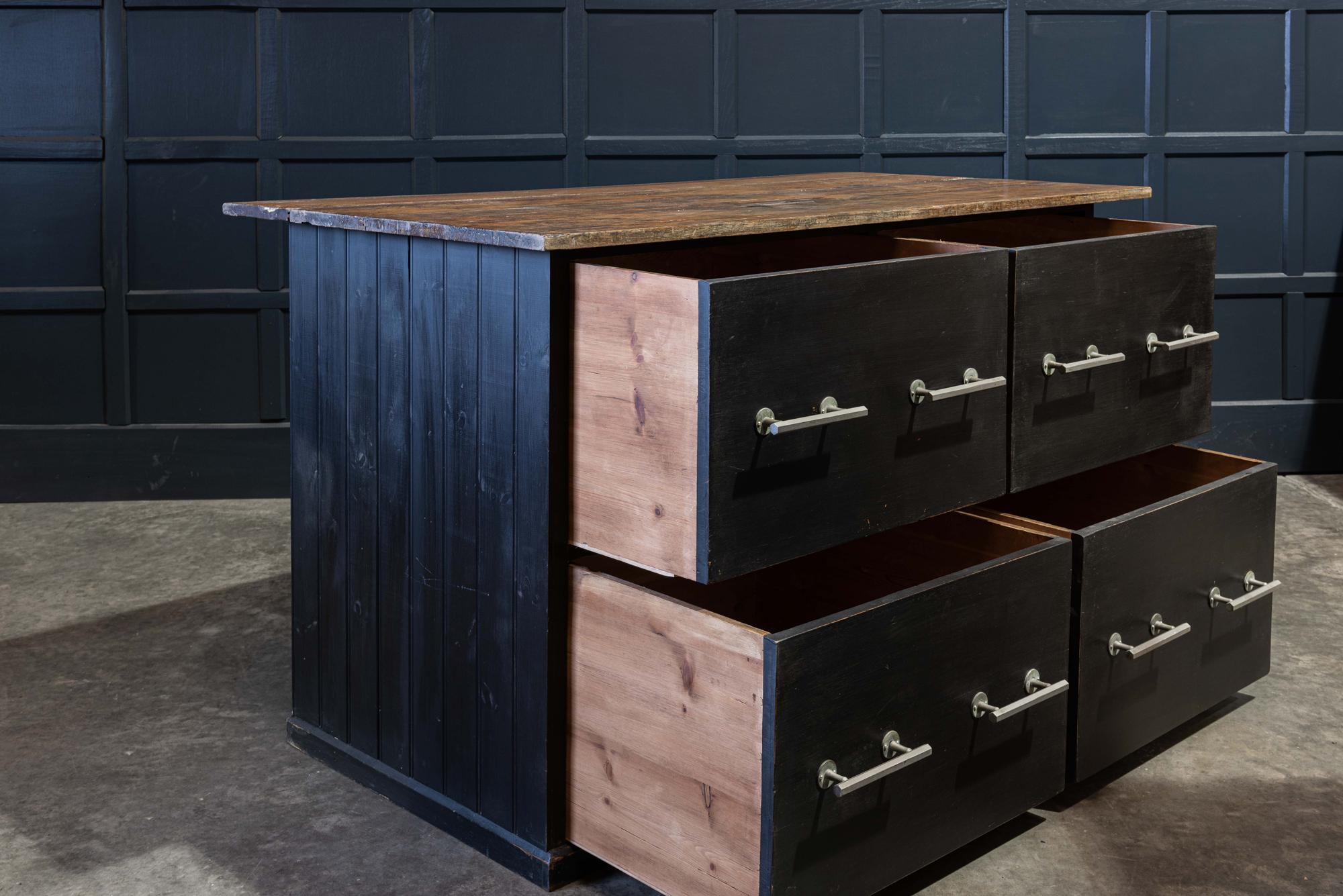 English ebonized hat shop counter kitchen island
circa 1930.

Original shop counter sourced from a hat shop in Cheshire.
4 large deep drawers with original bar handles, solid teak worktop with generous overhang, lovely wear and colour. Would be