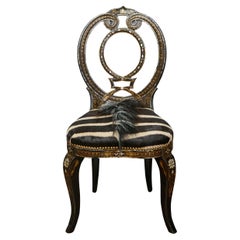 Silla inglesa ebonizada con incrustaciones de nácar y tapicería de piel de cebra