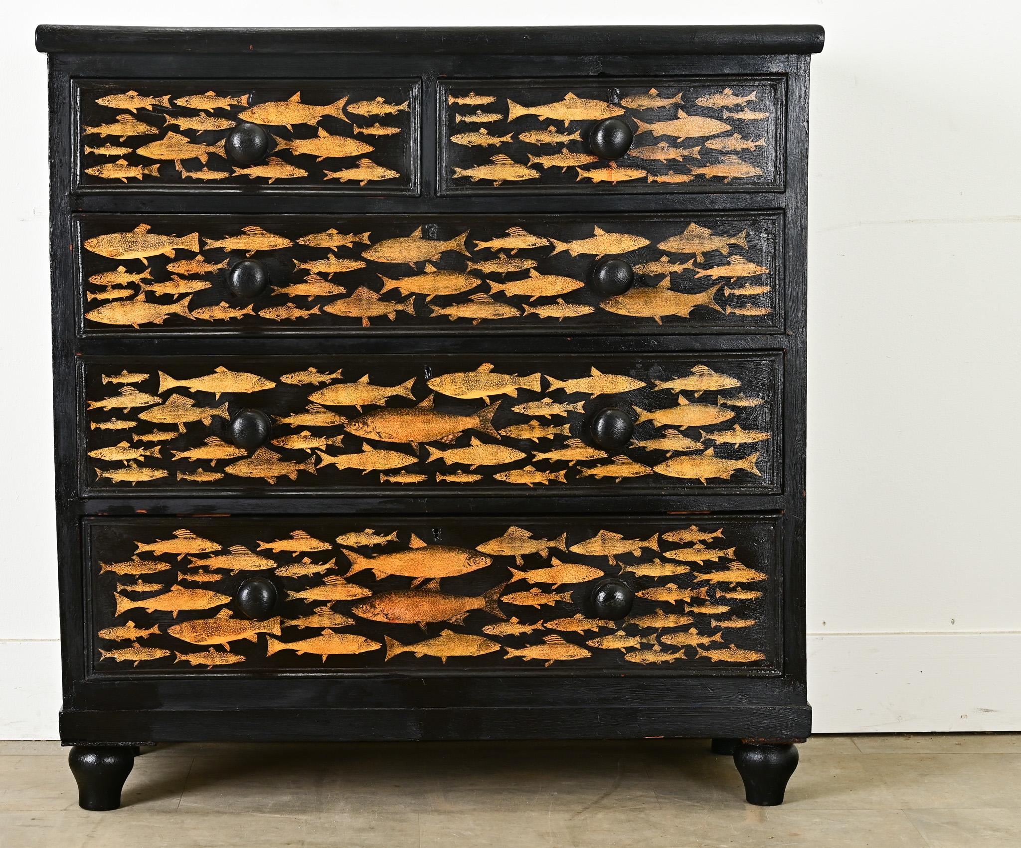 Recently updated with ebonizing and decoupage, this 1940s pine chest from England would be an entertaining addition to a beach or lake house, or child’s bedroom. Solid pine makes for sturdy construction of the case and five drawers with solid,