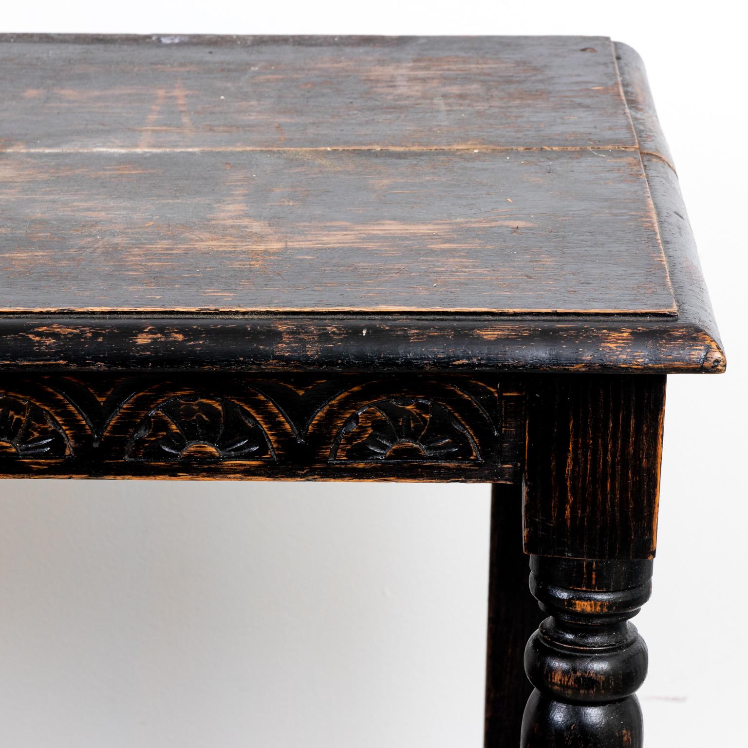 Circa late 19th century English ebonized oakwood three tier server table with vase-and-ring turned legs. Made in England. Please note of wear consistent with age.