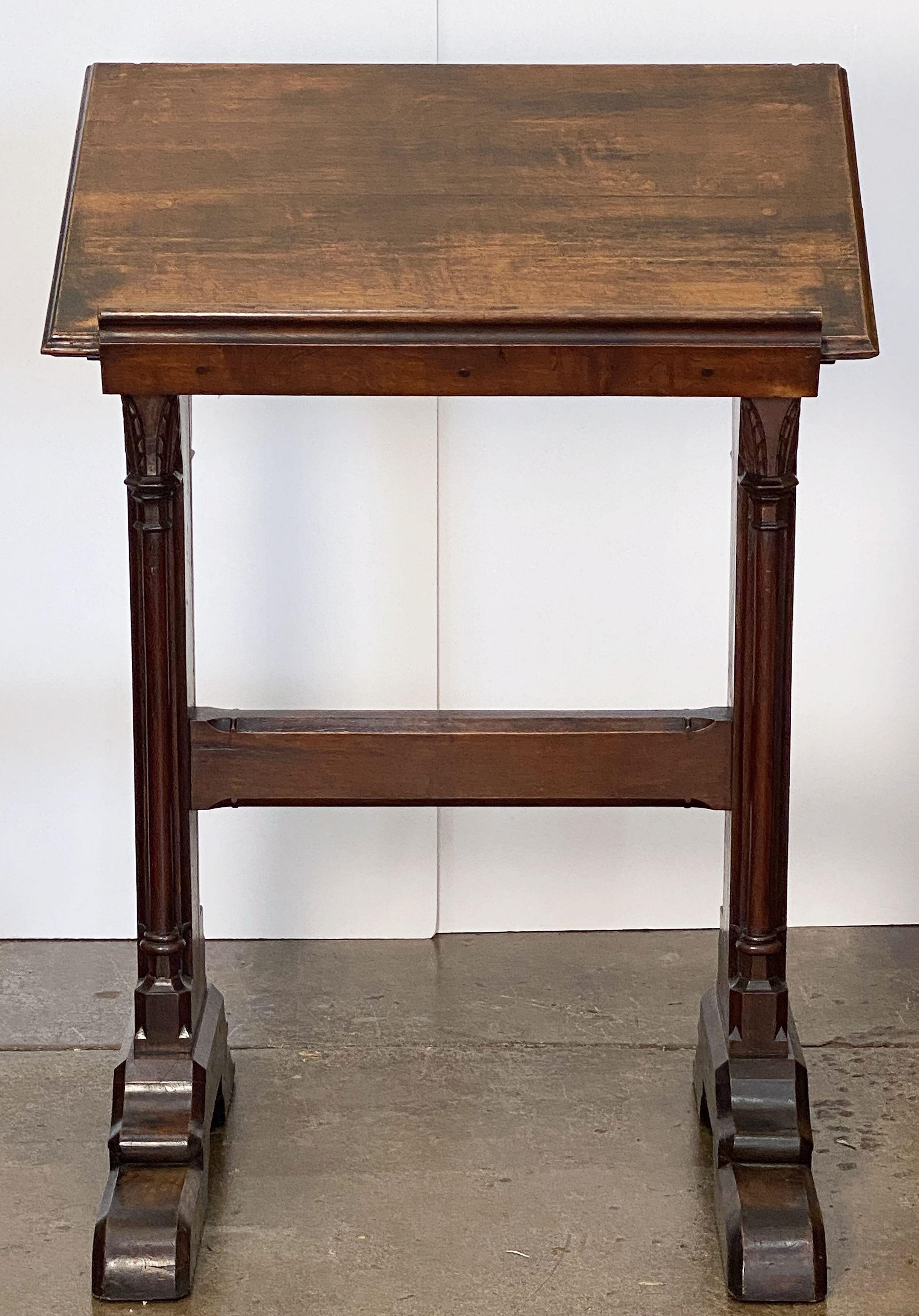 A handsome large English ecclesiastical standing lectern or easel of oak in the Gothic style, featuring one side with slanted stand with support rest for a book, the whole with carved Gothic designs, on a two-legged support.

Perfect for a collector