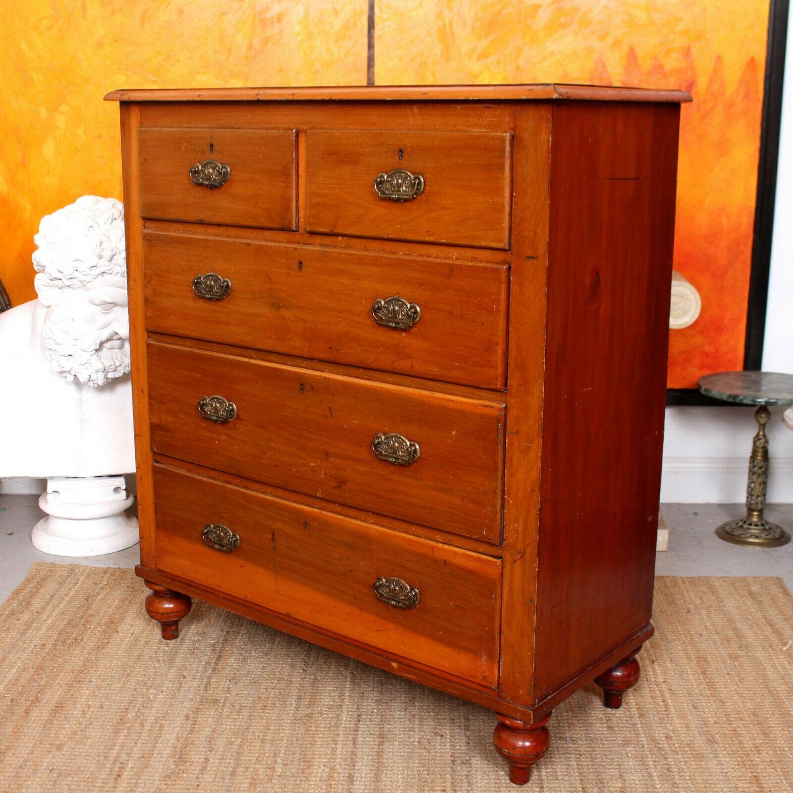 An impressive Edwardian chest of drawers.

The top with chamfered edges, fitted two short and three long graduated drawers with dovetailed jointing and mounted with good handles. Raised on fluted bun feet.