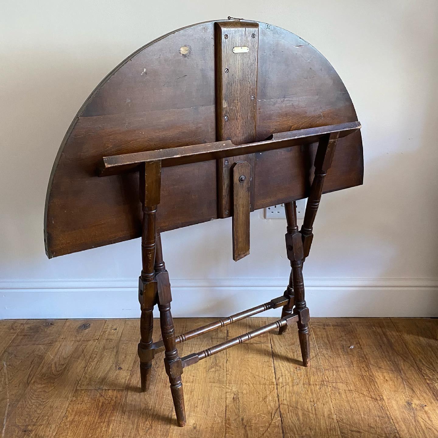 A very useful English Edwardian folding coaching table. Good solid folding and looking functions and ivorine makers plaque with indistinct name.

Sizes stated are for the open position.

Measures: height: 62cm

Width: 100.5cm

Depth: 100.5cm.