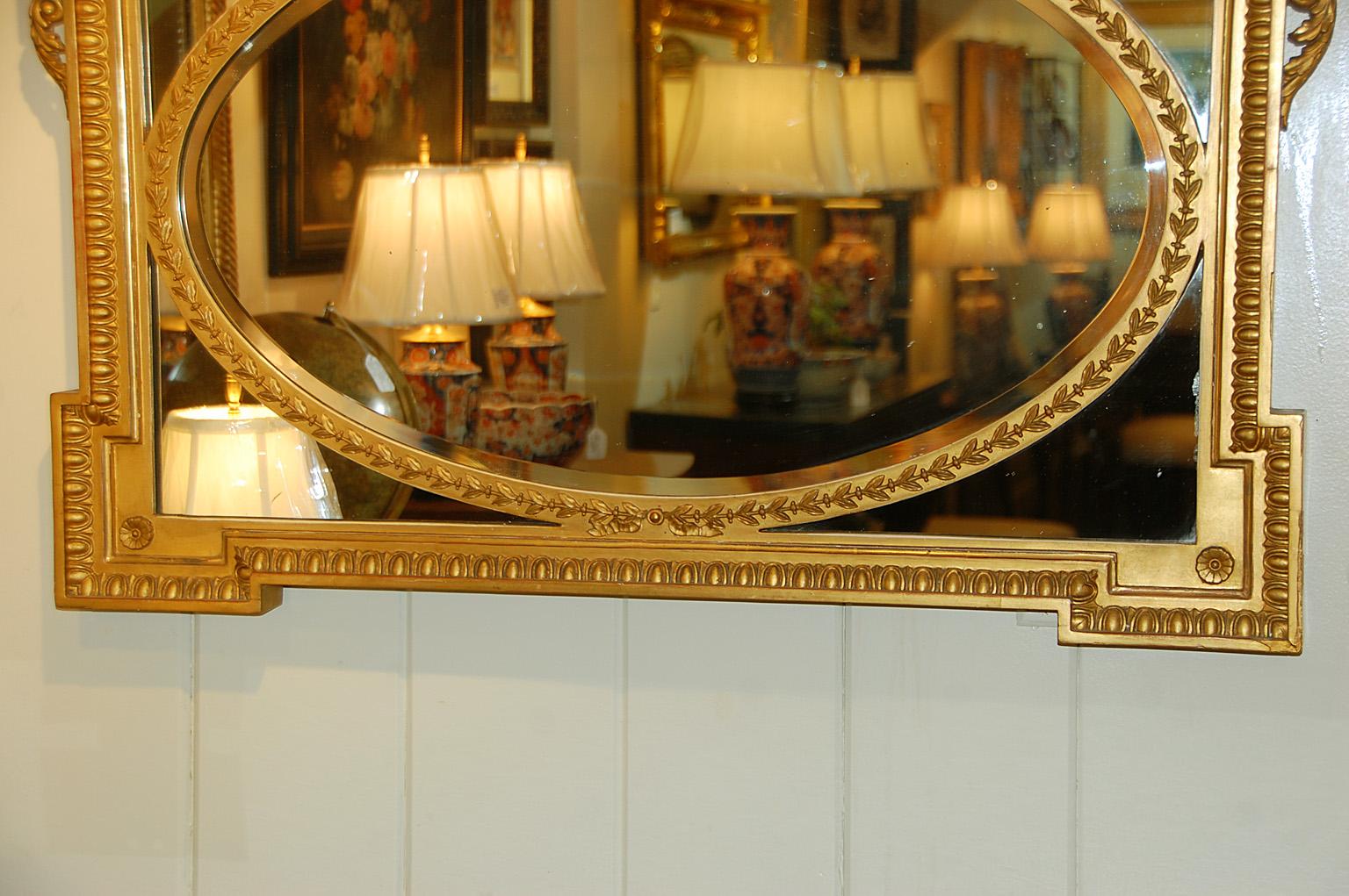 19th Century English Edwardian Gold Mirror with Urn and Trailing Leaves Surmounting the Frame For Sale