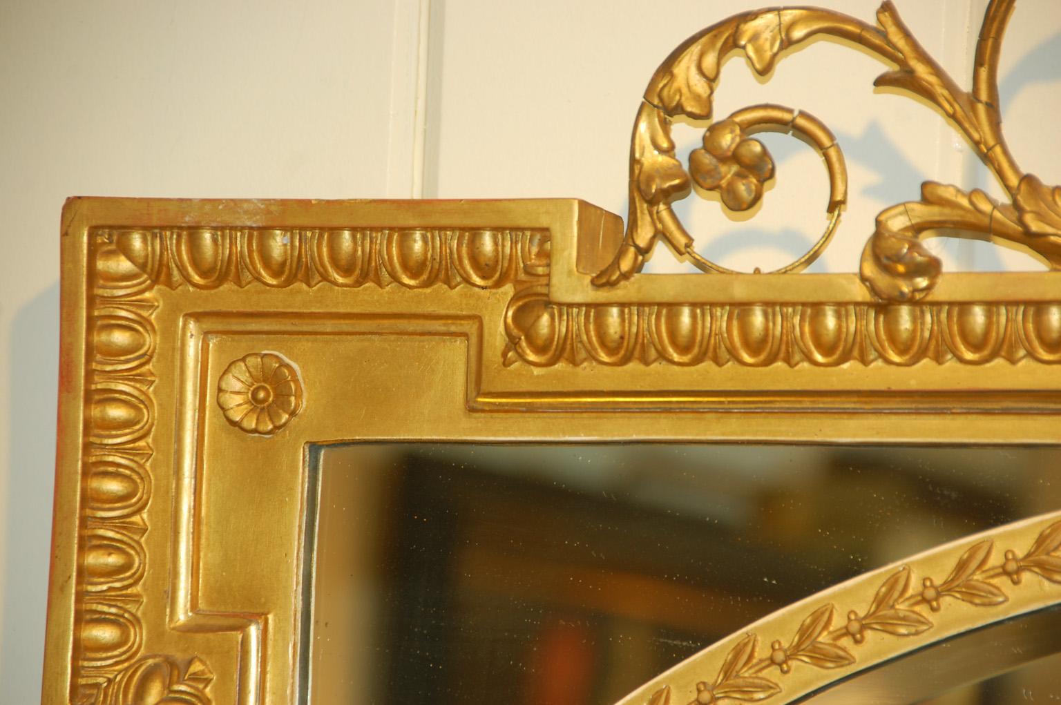 Wood English Edwardian Gold Mirror with Urn and Trailing Leaves Surmounting the Frame For Sale