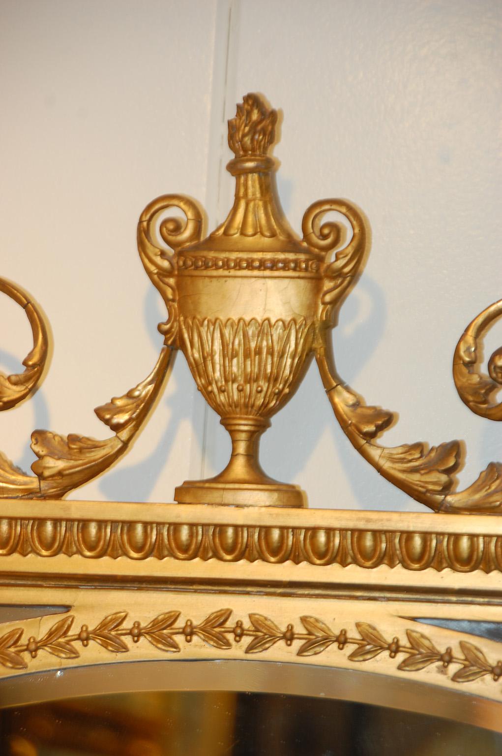 English Edwardian Gold Mirror with Urn and Trailing Leaves Surmounting the Frame For Sale 1