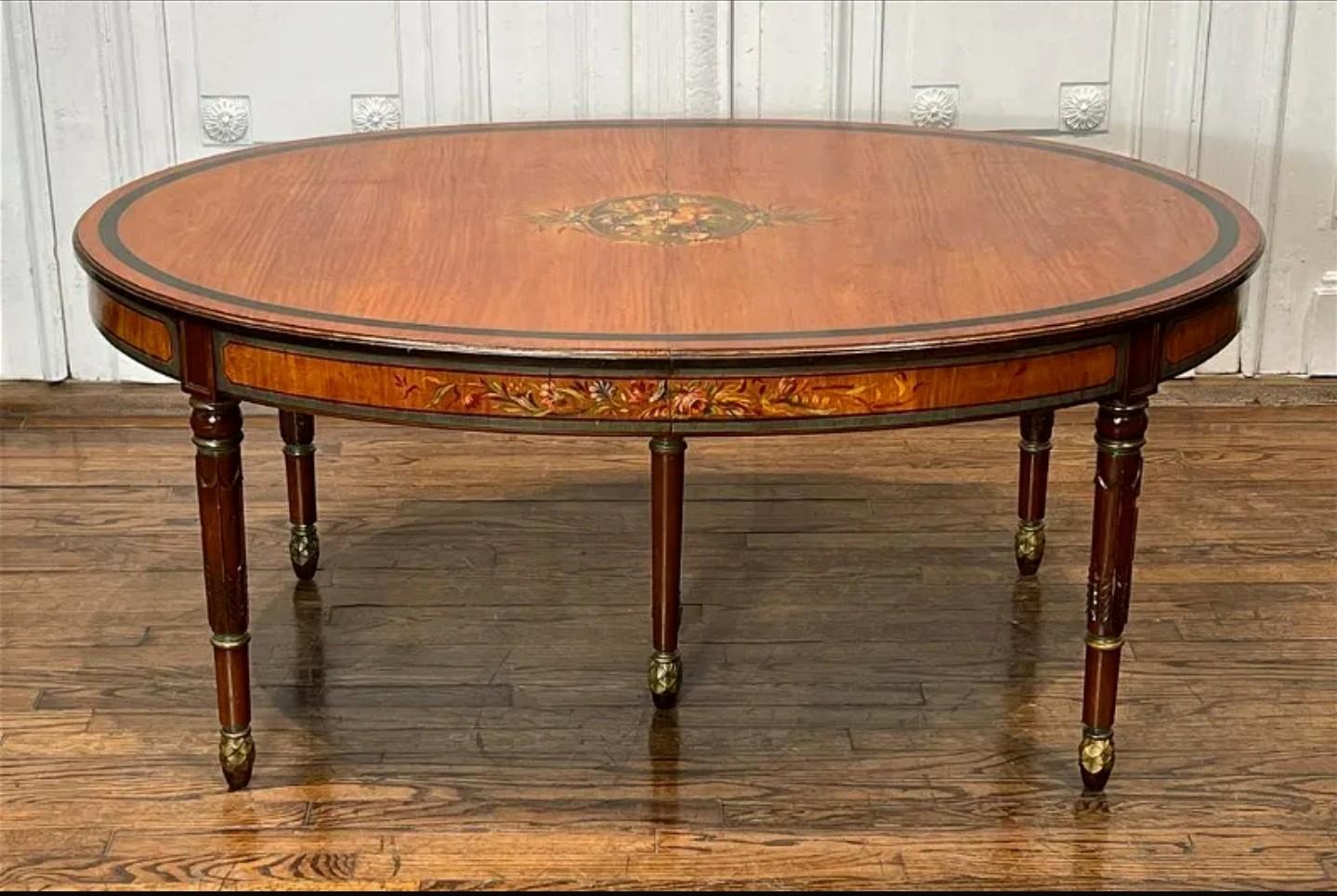 A one-of-a-kind Edwardian period (1901-1910) English Adam taste paint decorated satinwood extension dining breakfast table, professionally converted to a cocktail table, with reduced legs.

Exquisitely hand-crafted in the early 20th century, later