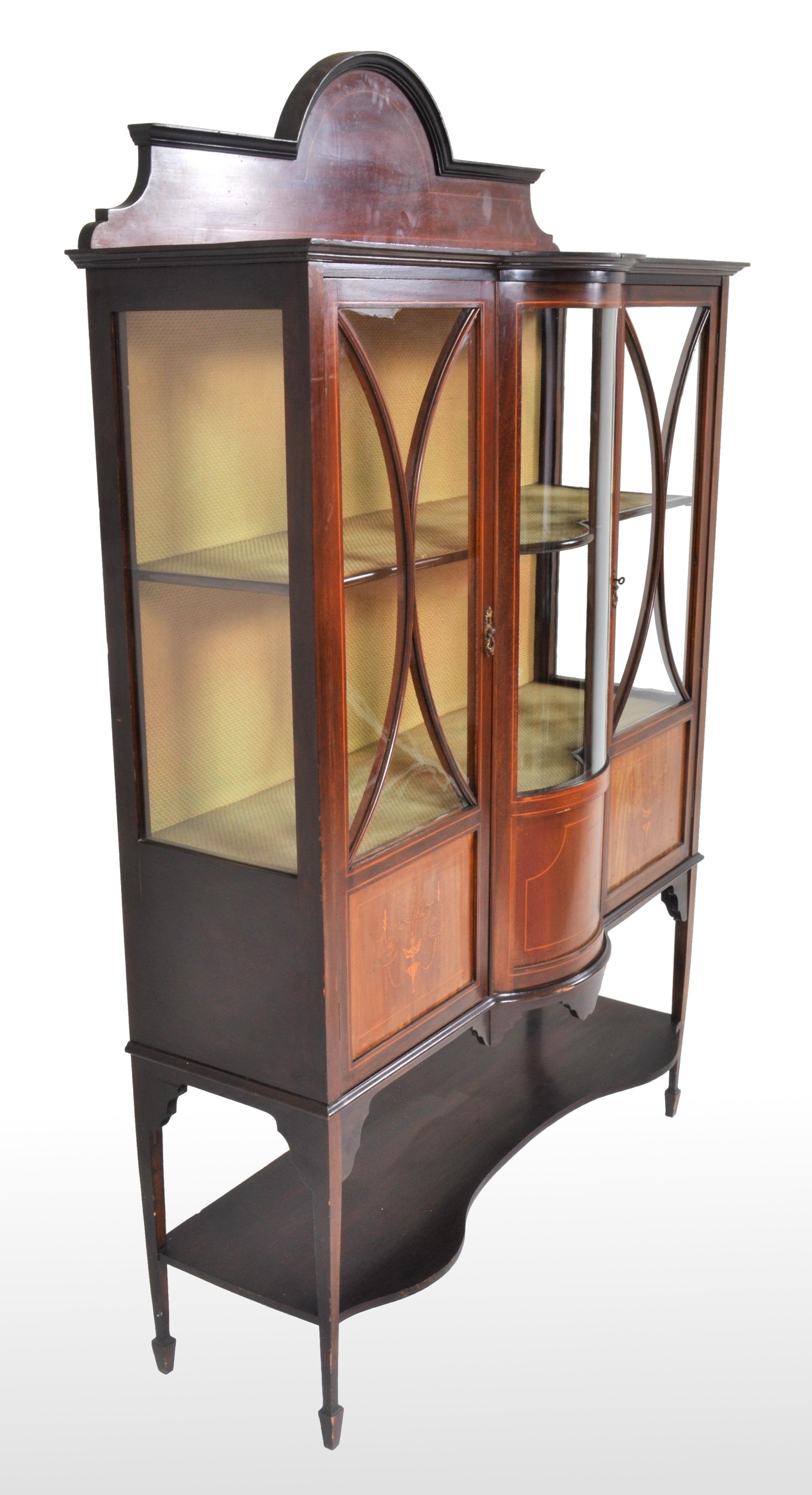 Antique English Edwardian Sheraton Revival inlaid mahogany China cabinet, Henry Barker Ltd, Nottingham circa 1895. The cabinet having an inlaid and arched gallery. Below are three doors, the central door with curved glass, each door having