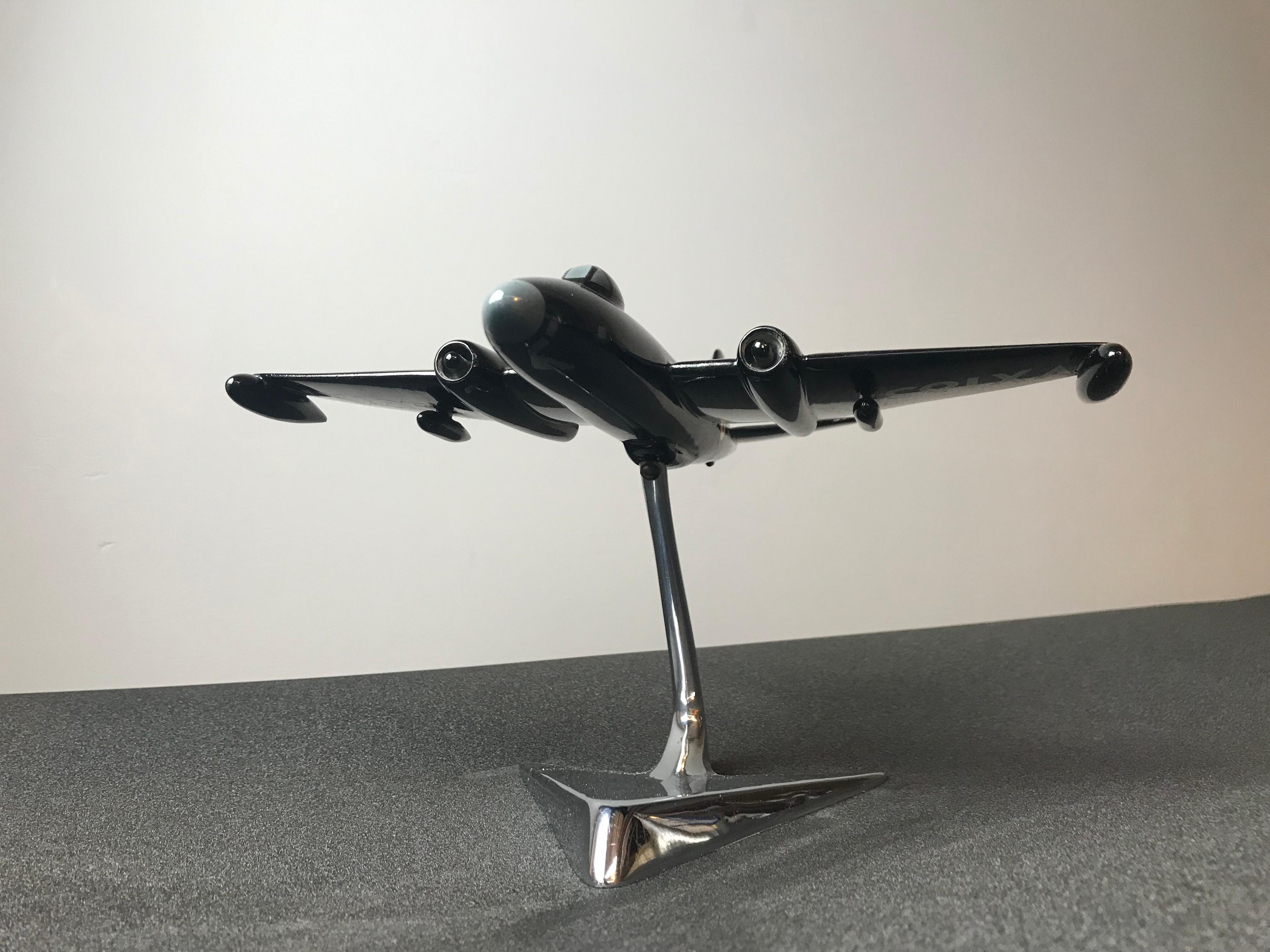 All metal manufacturers scale model of an English electric Canberra bomber aircraft. With RAF Night colours, bears the number VX185 (the record breaking aircraft to complete a double crossing of the Atlantic 26/8/52.
Mounted on a chrome-plated
