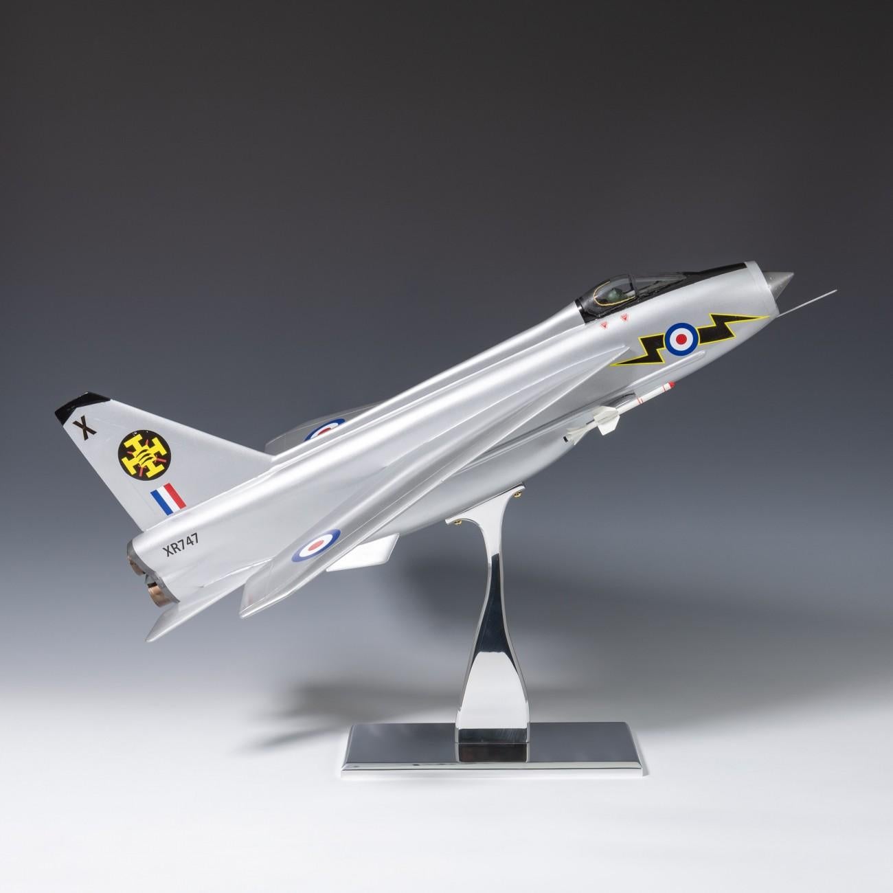 Splendid 1960s painted wooden model of an English electric lightning interceptor aircraft on a newly made polished aluminium stand. The model was a display item for the RAF Air Cadets.
Some work has been carried out to restore the original paint