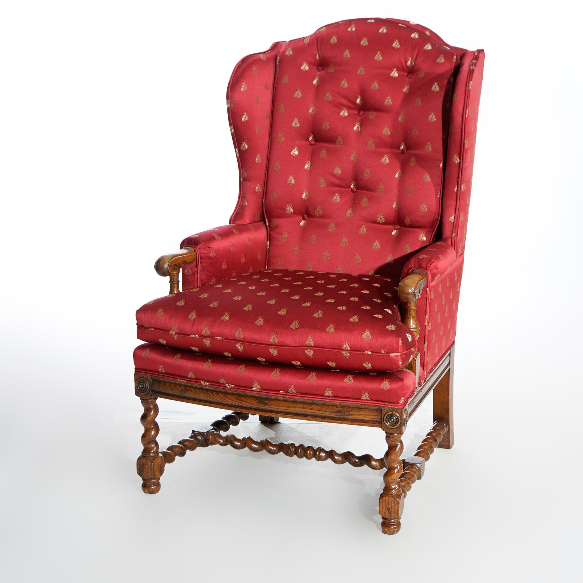 An antique English Elizabethan fire side wingback armchair offers upholstered button back with cushioned seat on cared oak barley twist frame having H-stretcher, 20th century

Measures- 45.25''H x 27.25''W x 33.75''D; 19.5'' seat height.