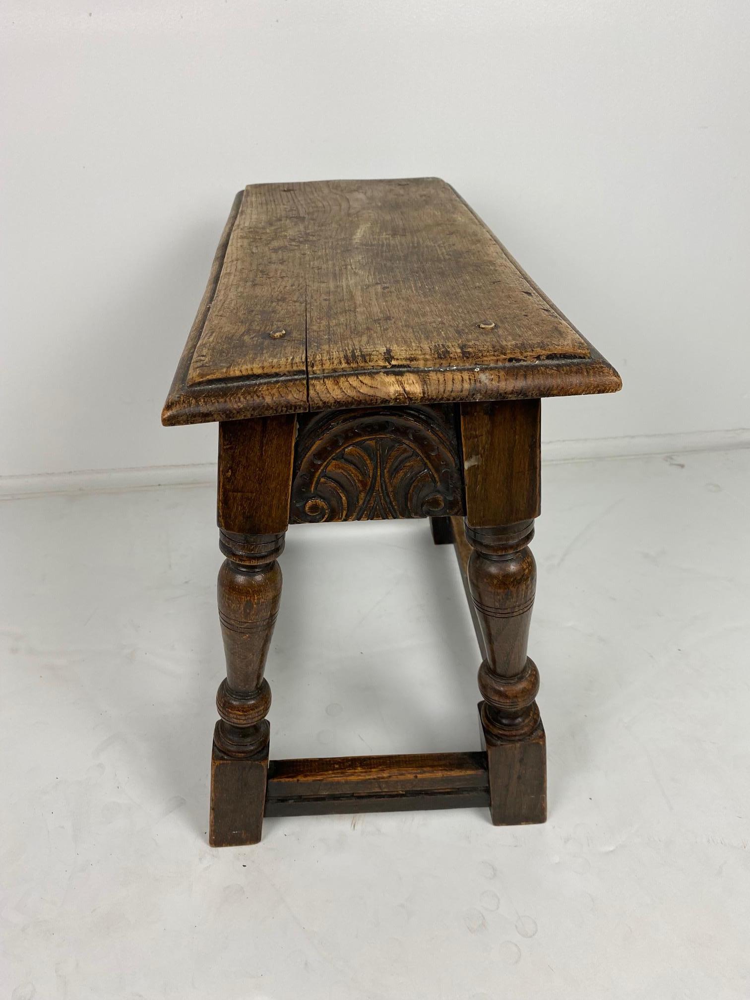 An 1890s English Elizabethan-style joint stool.