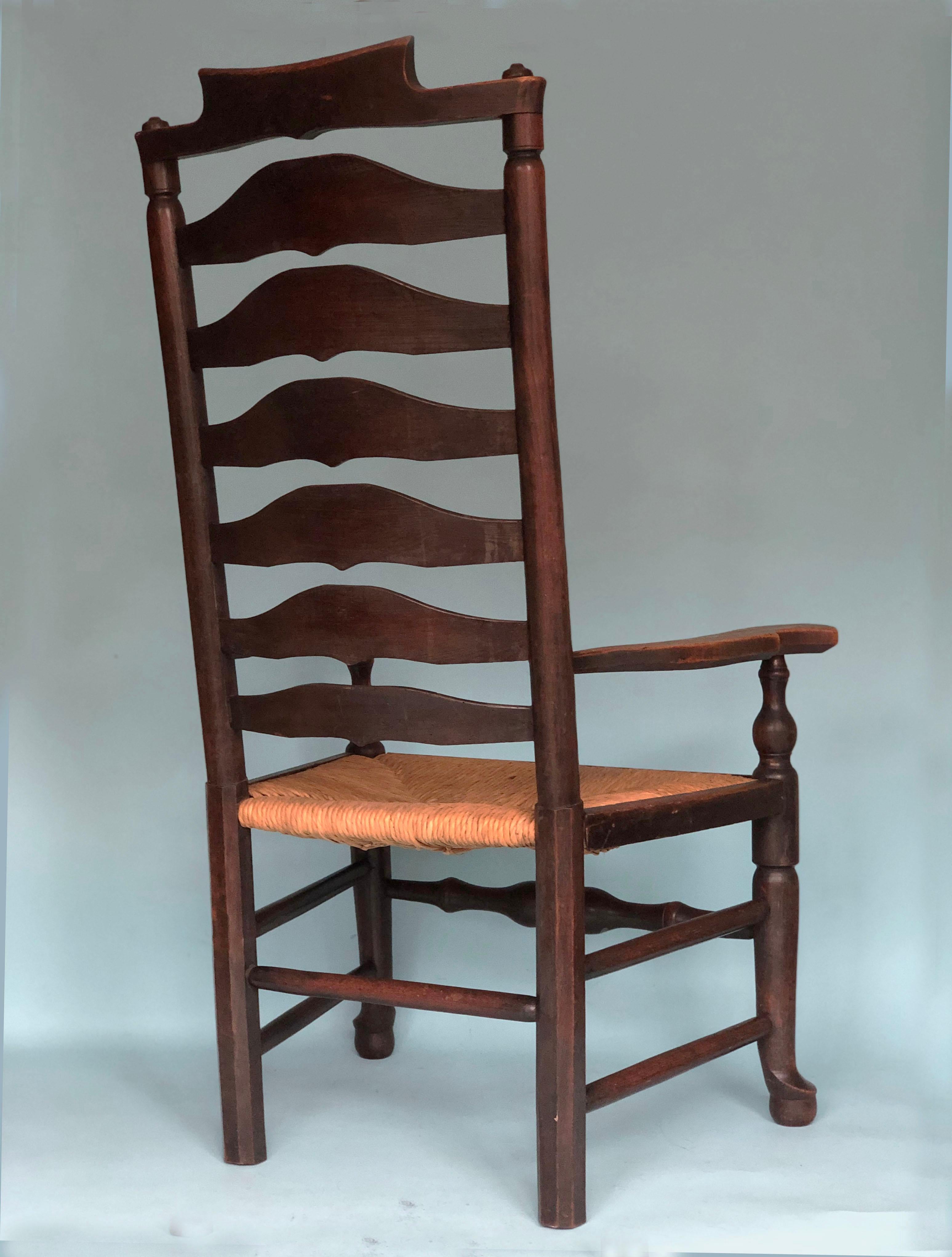 An English Ladder back armchair made in the late 19th century. The chair with a high back (7 “ladders) and rushed seat are in good condition. The wood is nicely weathered.

Object: Armchair
Designer: Unknown
Style: Antique
Period: 1880-1900
Country